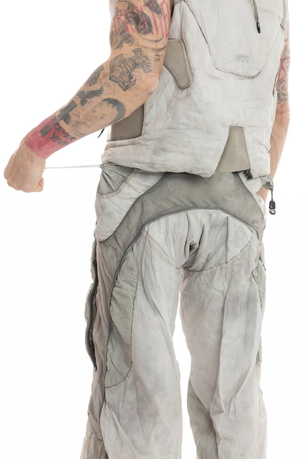 Hamcus, Mens Trousers, Light Grey, Dirt White, Straight Leg, Leg Zippers, Multi-Fabric, Translucent Inserts, Transparent, Zip Fly, Side Drawcord Pockets, Drawcord Elastic Waistband, Back 3/4 View Translucent Inserts Showcase. 