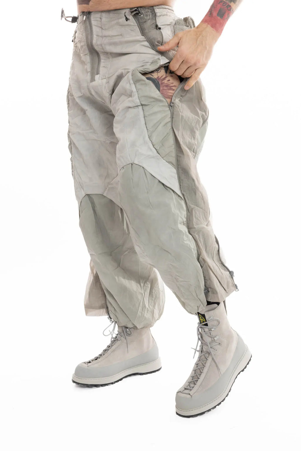Hamcus, Mens Trousers, Light Grey, Dirt White, Straight Leg, Leg Zippers, Multi-Fabric, Translucent Inserts, Transparent, Zip Fly, Side Drawcord Pockets, Drawcord Elastic Waistband, Front 3/4 Portrait. 