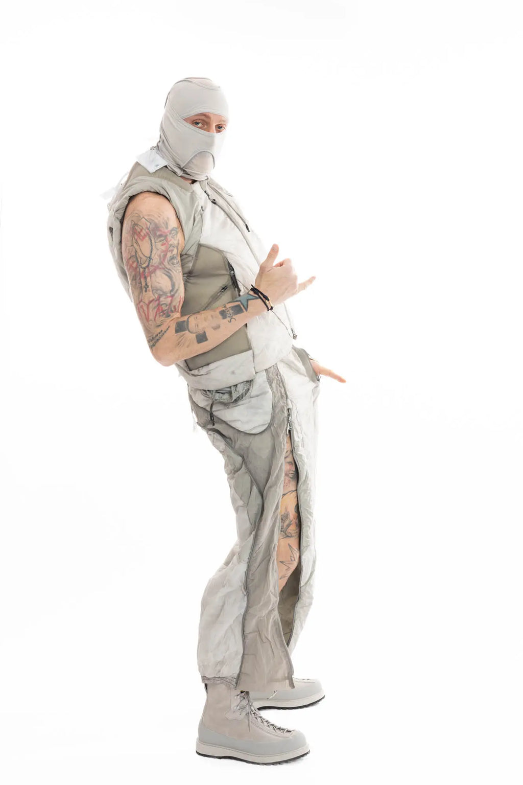 Hamcus, Mens Trousers, Light Grey, Dirt White, Straight Leg, Leg Zippers, Multi-Fabric, Translucent Inserts, Transparent, Zip Fly, Side Drawcord Pockets, Drawcord Elastic Waistband, Lean Back Side in-motion View. 