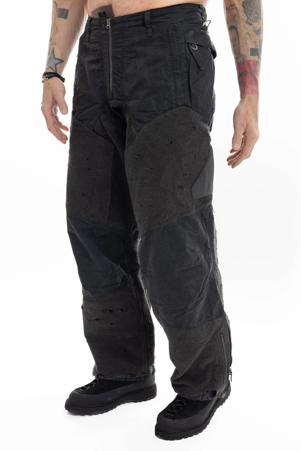 Hamcus, Mens Trousers, Black, Dark Grey, Straight Leg, Adjustable Cuffs, Side Pockets, Back Pockets, Belt Loops, Zip Fly, Multi Panel Construction, Leg Zips, Torn Design, Snap Closure, Drawcord Pockets, Vislon Zippers, Front 3/4 View. 