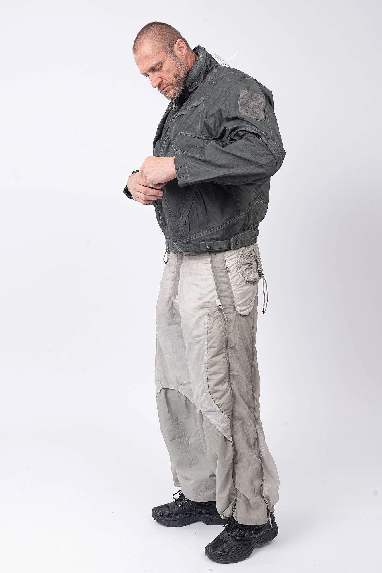 Hamcus, Mens Jacket, Fiend Grey, Dark Grey, Gray, Garment Dyed, Multiple Functional Pockets, Detachable Sleeves, Convertible Jacket, Full-Zip, Ventilation Eyelets, Zip Pockets, Centre Zip Closure, Detachable Lining Vest, Removable Vest Lining, 3-in-1 Garment, Convertible, Full Body Side View Looking Down. 