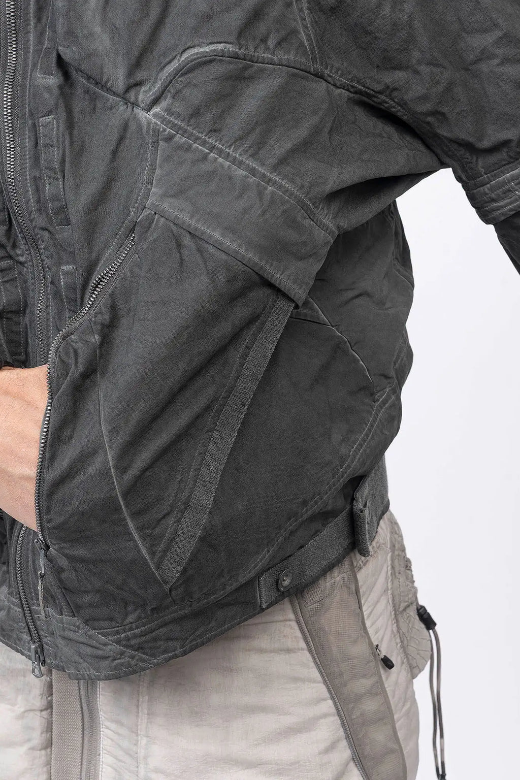 Hamcus, Mens Jacket, Fiend Grey, Dark Grey, Gray, Garment Dyed, Multiple Functional Pockets, Detachable Sleeves, Convertible Jacket, Full-Zip, Ventilation Eyelets, Zip Pockets, Centre Zip Closure, Detachable Lining Vest, Removable Vest Lining, 3-in-1 Garment, Convertible, Hand in Left Pocket Close-up. 