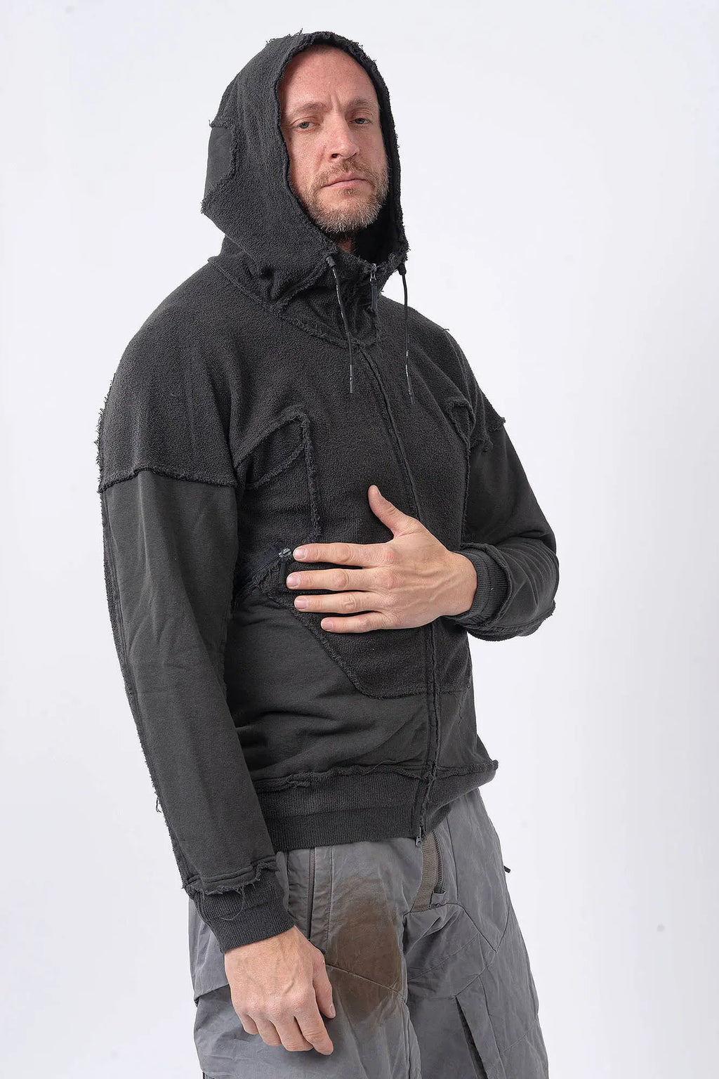 Hamcus, Mens Jacket, Black, Washed Effect, Cloudy Black, Long Sleeves, Zip Side Pockets, Hooded, Panel Design, Patchwork Construction, Ribbed Cuffs and Hem, Paracord Adjustable Hood, LP World, Full-Zip, Centre Zip Closure, Front 3/4 Portrait Hand on Chest. 