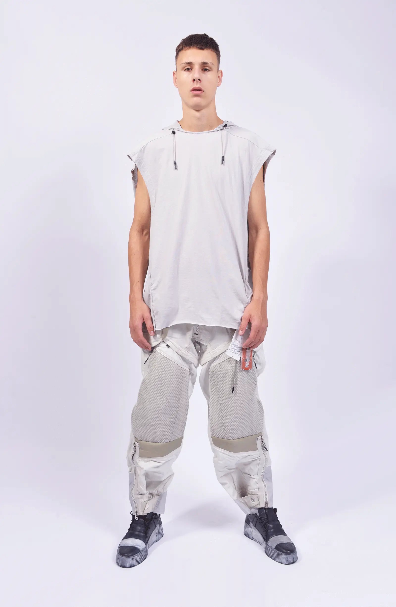 Hamcus, Mens Pants, White, Drawcord Pockets, Side Pockets, Leg Zippers, Adjustable Cuffs, Breathable Mesh, Breathable Legs, Back Pockets, Ventilation Zip Openings, Multi-Fabric Construction, Patchwork Design, Honeycomb Panels, Foam Modules, Full Body Front View. 