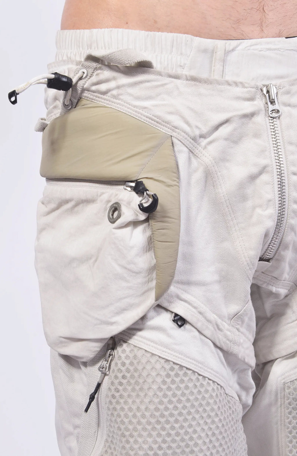 Hamcus, Mens Pants, White, Drawcord Pockets, Side Pockets, Leg Zippers, Adjustable Cuffs, Breathable Mesh, Breathable Legs, Back Pockets, Ventilation Zip Openings, Multi-Fabric Construction, Patchwork Design, Honeycomb Panels, Foam Modules, Side Pocket Close-up. 