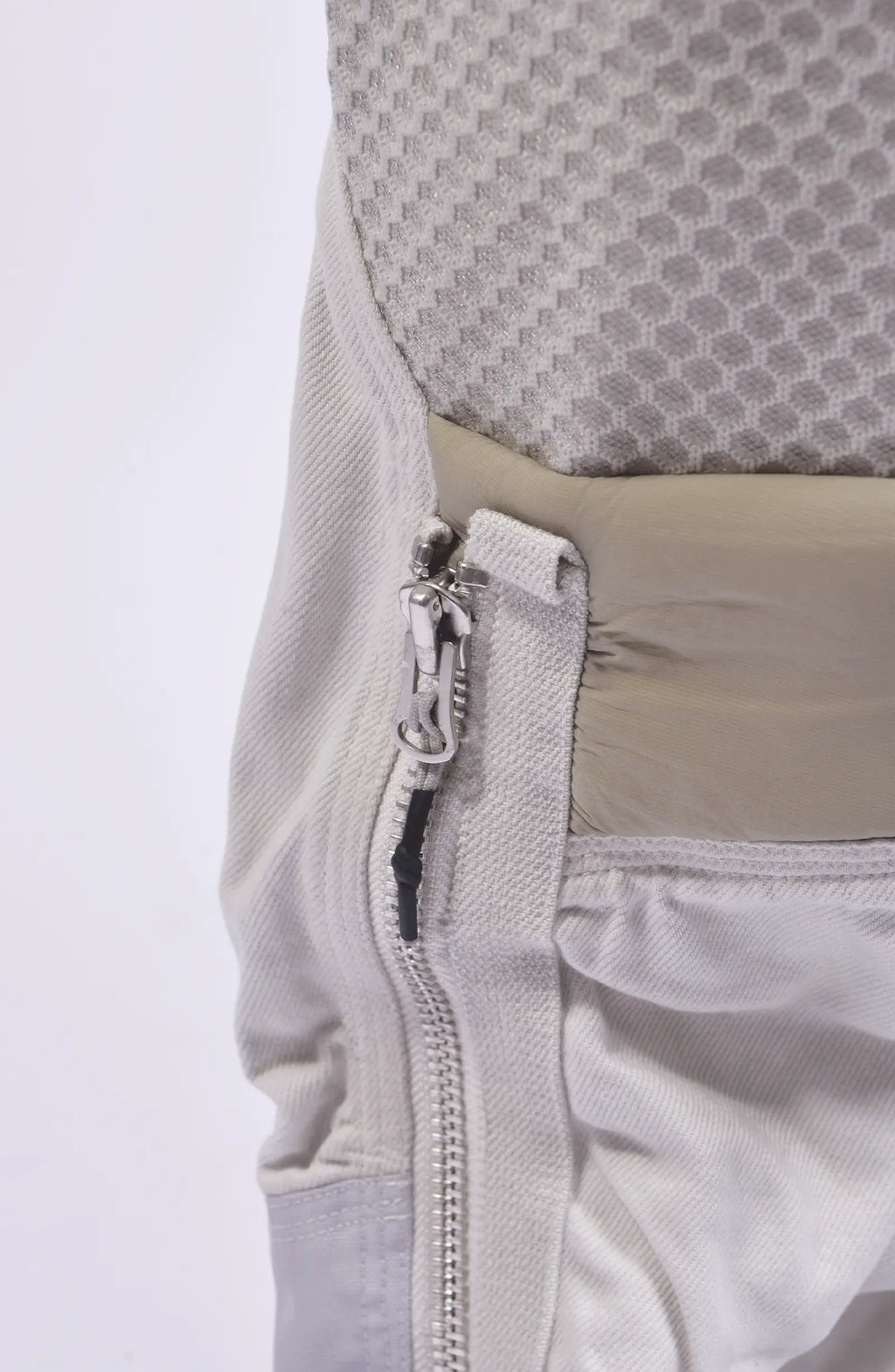 Hamcus, Mens Pants, White, Drawcord Pockets, Side Pockets, Leg Zippers, Adjustable Cuffs, Breathable Mesh, Breathable Legs, Back Pockets, Ventilation Zip Openings, Multi-Fabric Construction, Patchwork Design, Honeycomb Panels, Foam Modules, Leg Zipper Close-up. 