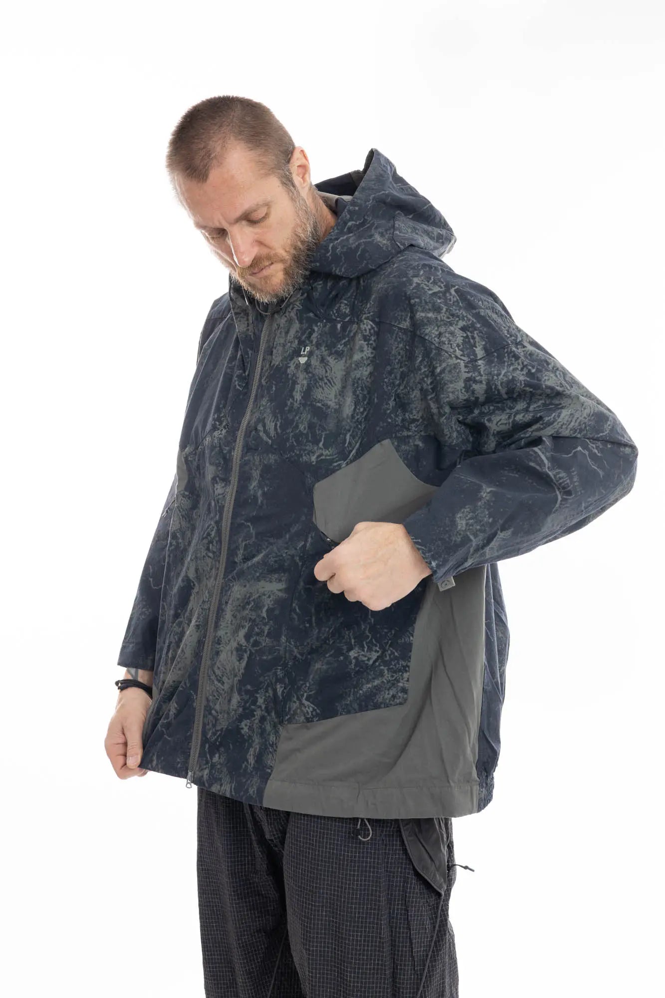Hamcus, Mens Jacket, Geomapping Scan Print, Blue, Gray, Black, Hooded, Drawcord Hood, Side Pockets, Full Zip, Chest Logo, Waterproof, Grey Panel Inserts, Cotton, Polyamide, Elastic Cuffs and Hem, Adjustable Hem, Zip Pockets, Front 3/4 View Unzipping side Pocket. 