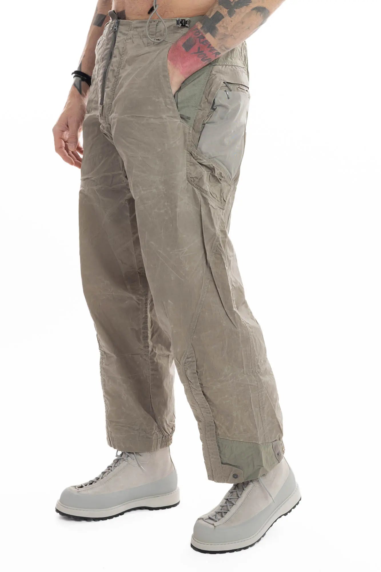 Hamcus, Mens Trousers, Olive, Beige, Light Brown, Smeared, Side Zips, Side ZIppers, Adjustable Cuffs, Elastic Drawcord Waistband, Belt Loops, Zip-Fly, Back Pockets, Polyester, Polyamide, Translucent, Transparent, Straight Leg, Wide-fit, Front 3/4 View. 