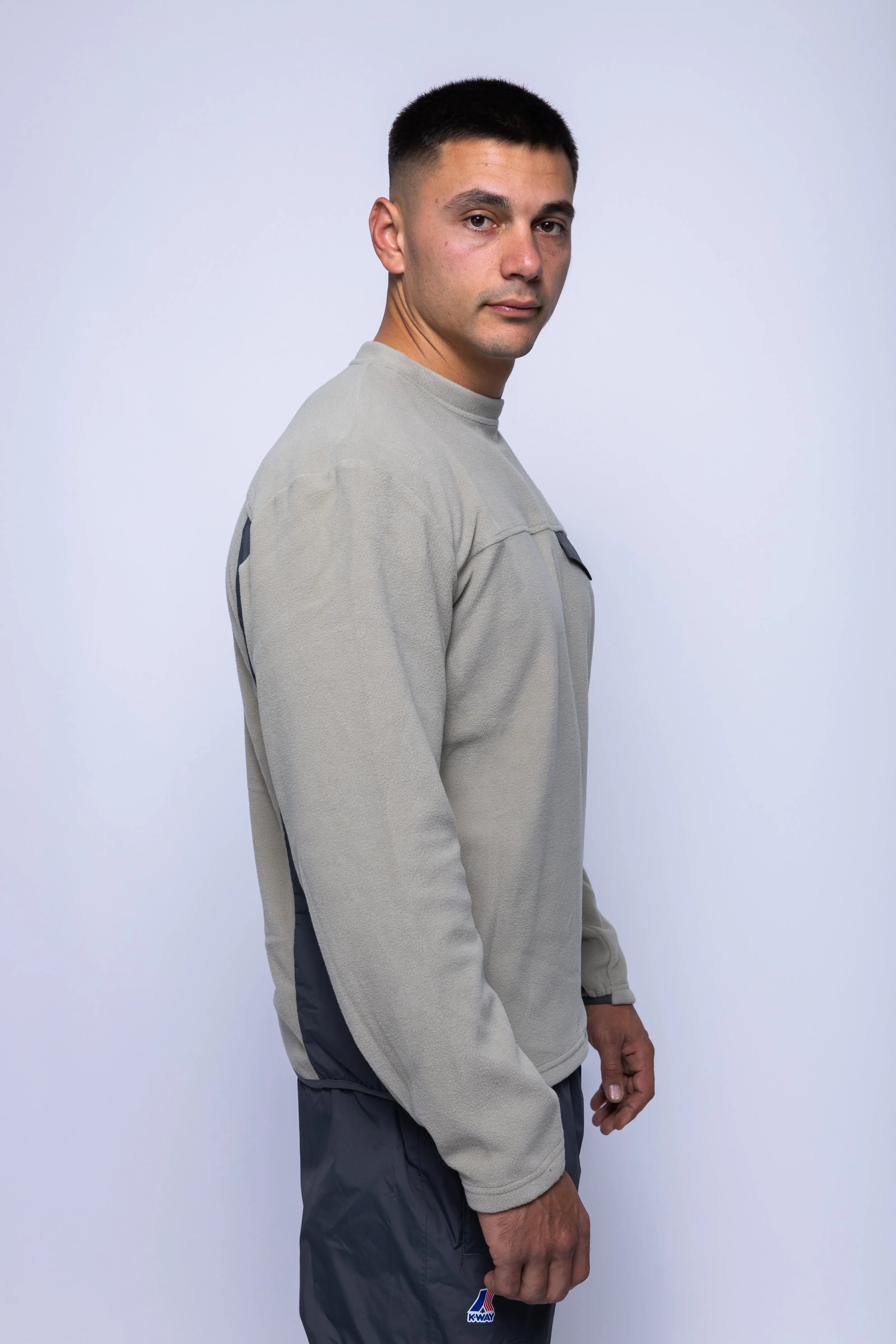 K-Way, Mens Sweatshirt, Grey, Fleece Jumper, Padded Nylon Inserts, Chest Flap Pocket, Snap Pocket, Long Sleeves, Chest Logo, Ribbed Neck, Side View. 
