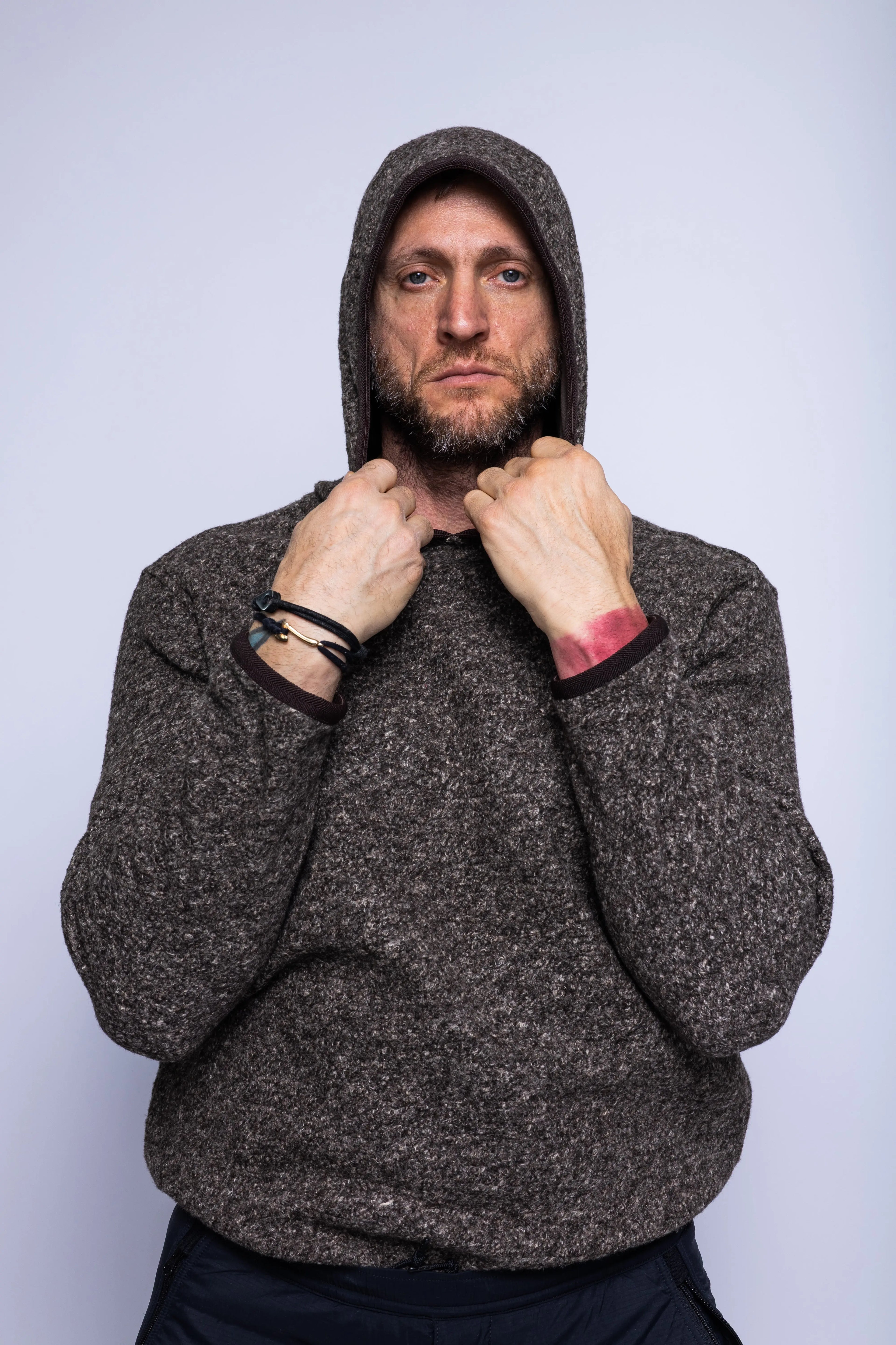 K-Way, Mens Sweatshirt, Black Brown Combo, Hooded, Aviron Wool Blend, Elasticated Hem and Cuffs, Long Sleeves, Melange, Insulated, Thermal, Front View Holding the Hood. 