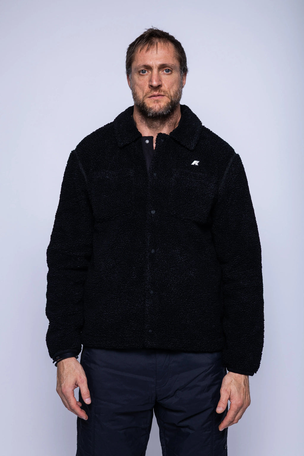 K-Way, Mens Polar, Black, Snap Button Closure, Side Pockets, Elasticated Cuffs, Brushed Fleece, Double-Layer Fleece, Silicone Logo-Patch, Shirt Collar, Front Portrait. 