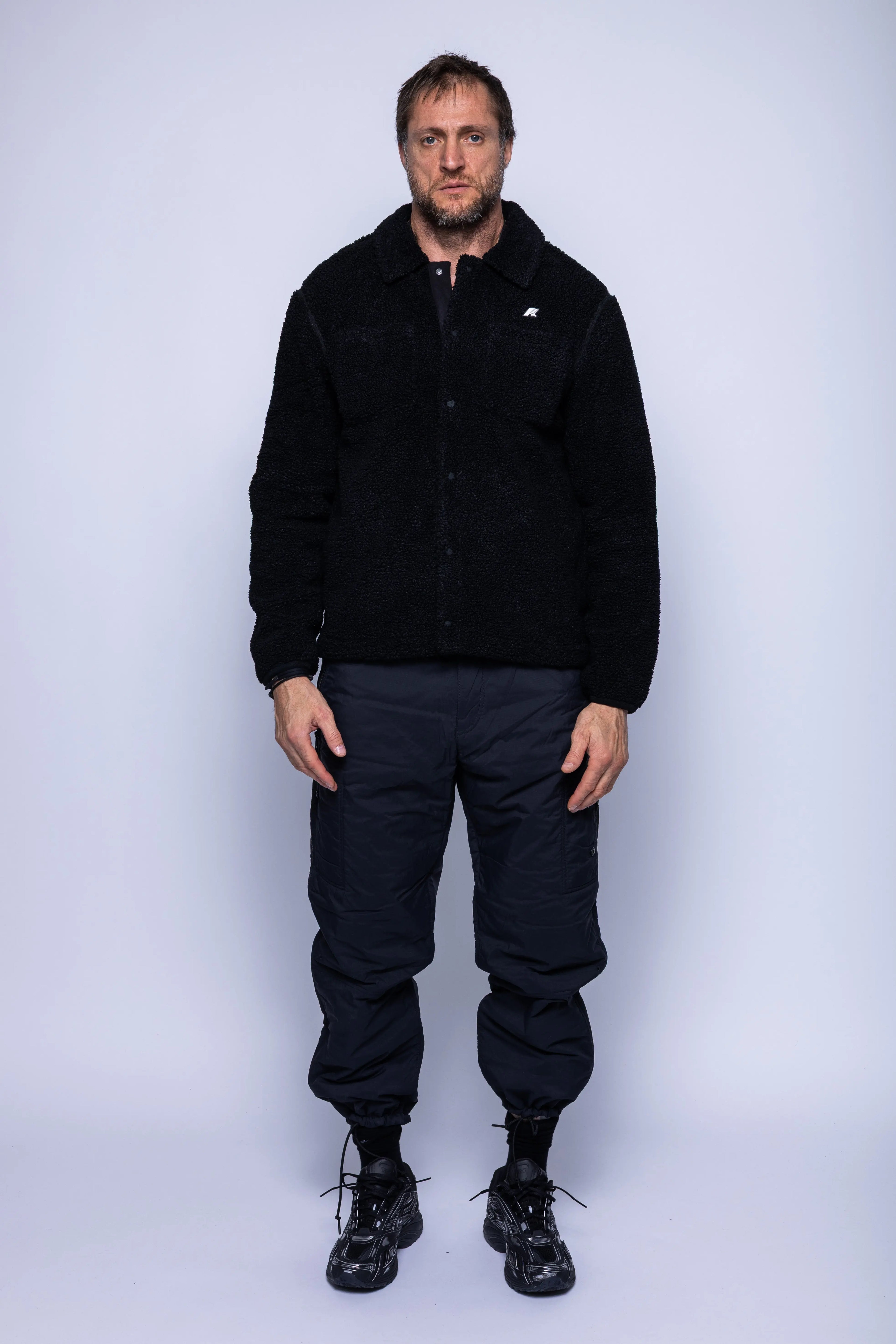 K-Way, Mens Polar, Black, Snap Button Closure, Side Pockets, Elasticated Cuffs, Brushed Fleece, Double-Layer Fleece, Silicone Logo-Patch, Shirt Collar, Full Body Front View. 