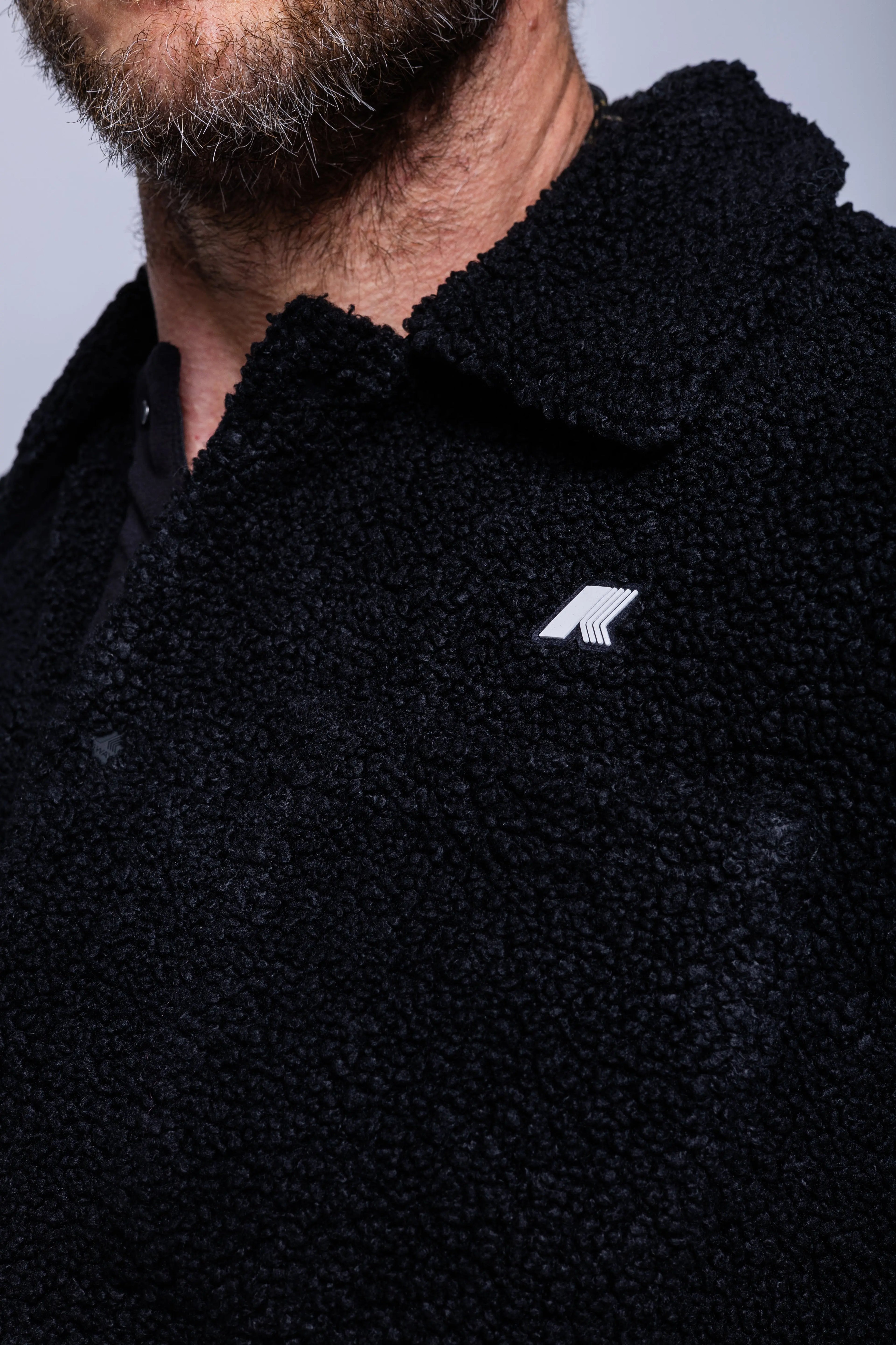 K-Way, Mens Polar, Black, Snap Button Closure, Side Pockets, Elasticated Cuffs, Brushed Fleece, Double-Layer Fleece, Silicone Logo-Patch, Shirt Collar, Logo Close-up. 