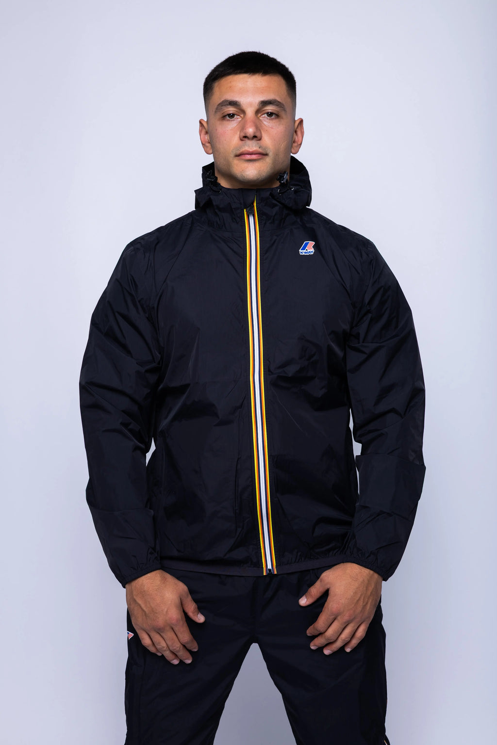 K-Way, Mens Jacket, Black, Unisex, Full-Zip, Chest Logo, Branded Zippers, Long Sleeves, Waterproof 10000 mm water column, Windproof 10000 g/sqm/24h, Heat Taped Seams, Elasticated Cuffs and Hem, Hooded, Drawcord, Front Portrait. 