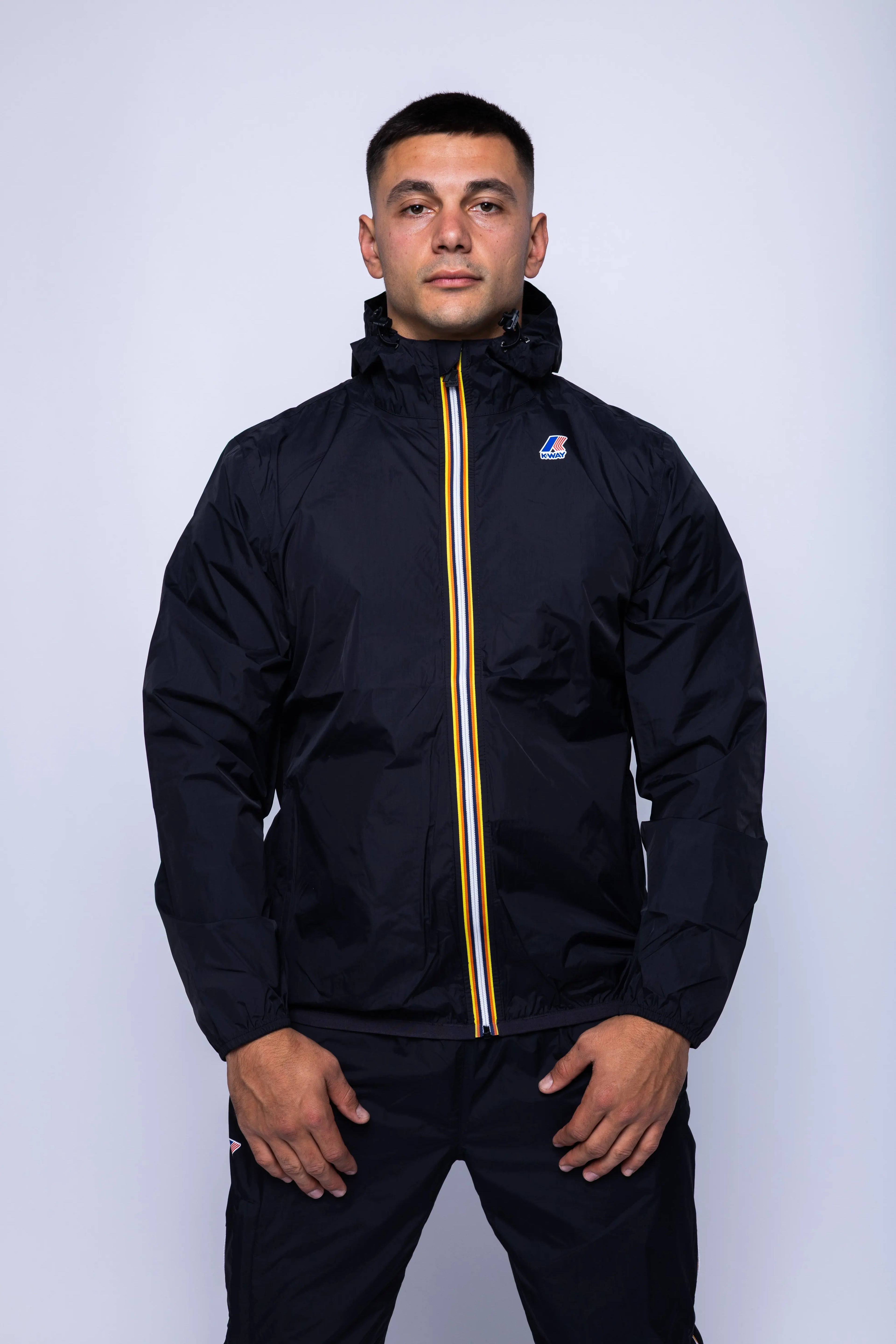 K-Way, Mens Jacket, Black, Unisex, Full-Zip, Chest Logo, Branded Zippers, Long Sleeves, Waterproof 10000 mm water column, Windproof 10000 g/sqm/24h, Heat Taped Seams, Elasticated Cuffs and Hem, Hooded, Drawcord, Front Portrait. 