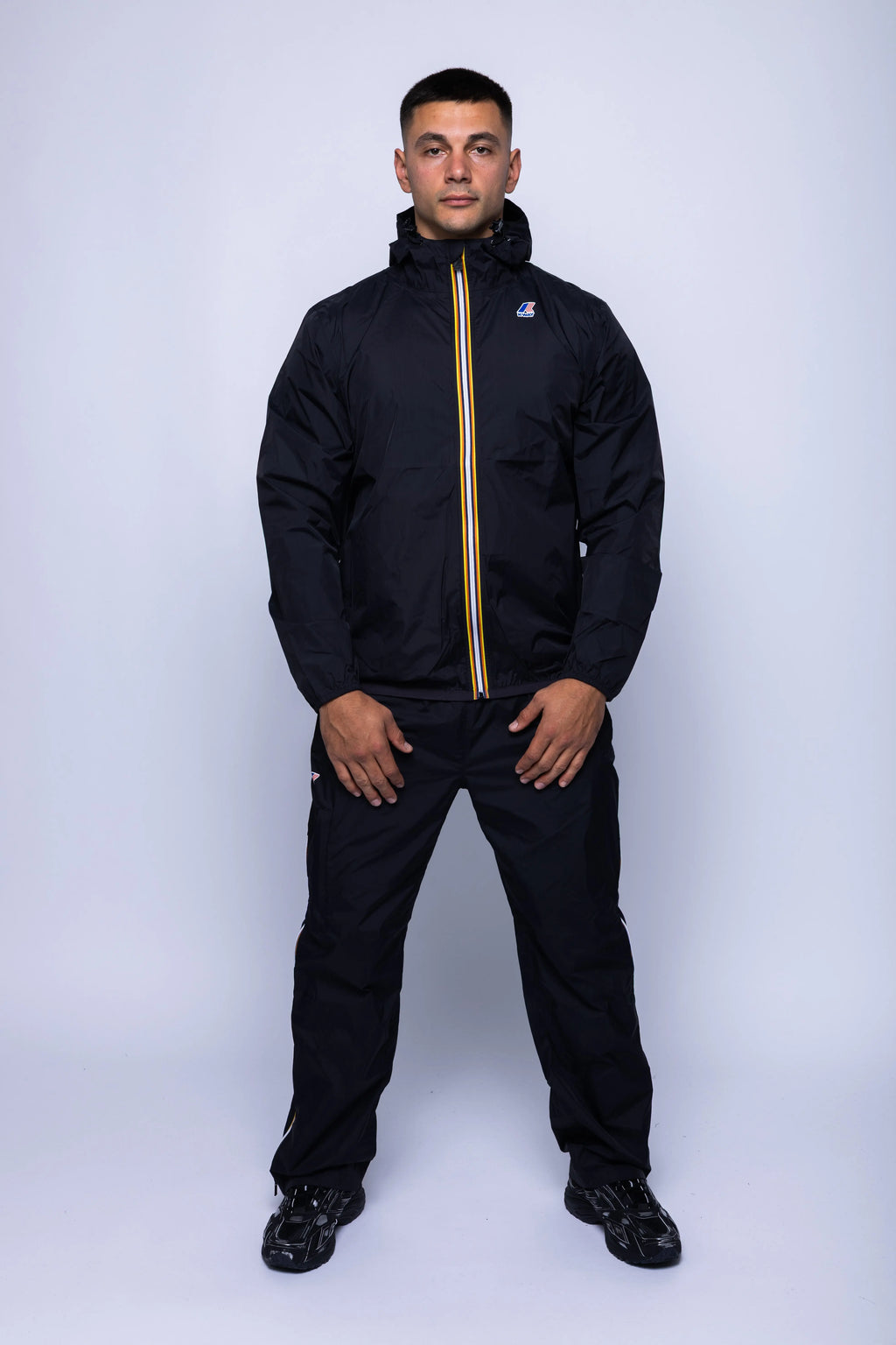 K-Way, Mens Jacket, Black, Unisex, Full-Zip, Chest Logo, Branded Zippers, Long Sleeves, Waterproof 10000 mm water column, Windproof 10000 g/sqm/24h, Heat Taped Seams, Elasticated Cuffs and Hem, Hooded, Drawcord, Full Body Front View. 