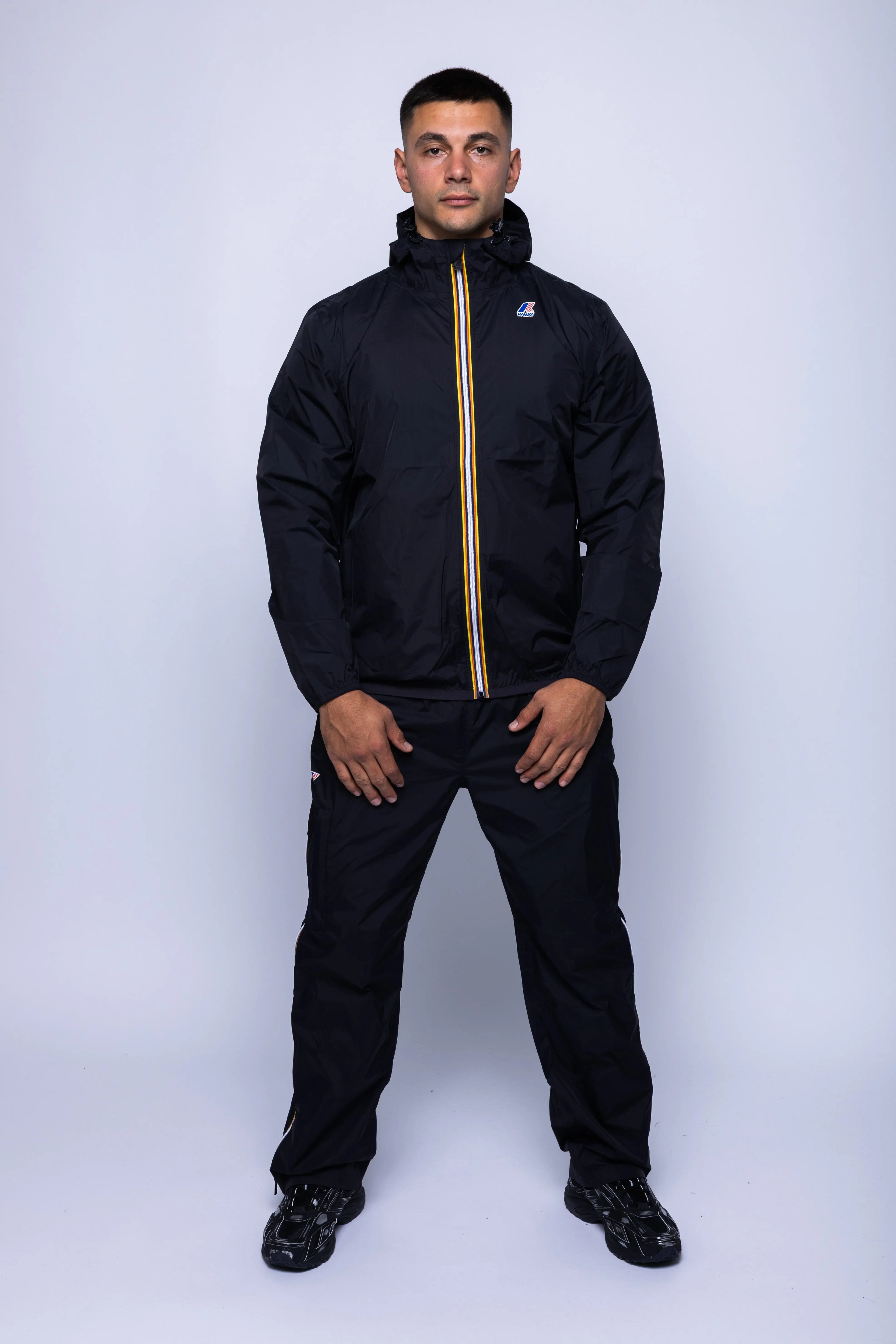 K-Way, Mens Jacket, Black, Unisex, Full-Zip, Chest Logo, Branded Zippers, Long Sleeves, Waterproof 10000 mm water column, Windproof 10000 g/sqm/24h, Heat Taped Seams, Elasticated Cuffs and Hem, Hooded, Drawcord, Full Body Front View. 