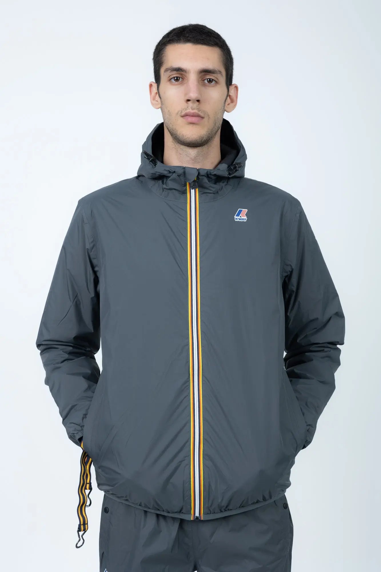 K-Way, Mens Jacket, Grey Shadow DK, Full-Zip, Hooded, Side Pockets, Branded Zippers, Packable, Unisex, Long Sleeves, Waterproof 10000 mm water column, Windproof, Breathable, Water-Repellent, Elasticated Cuffs and Hem, Breathability: 10000 g/sqm/24h, Front Portrait. 