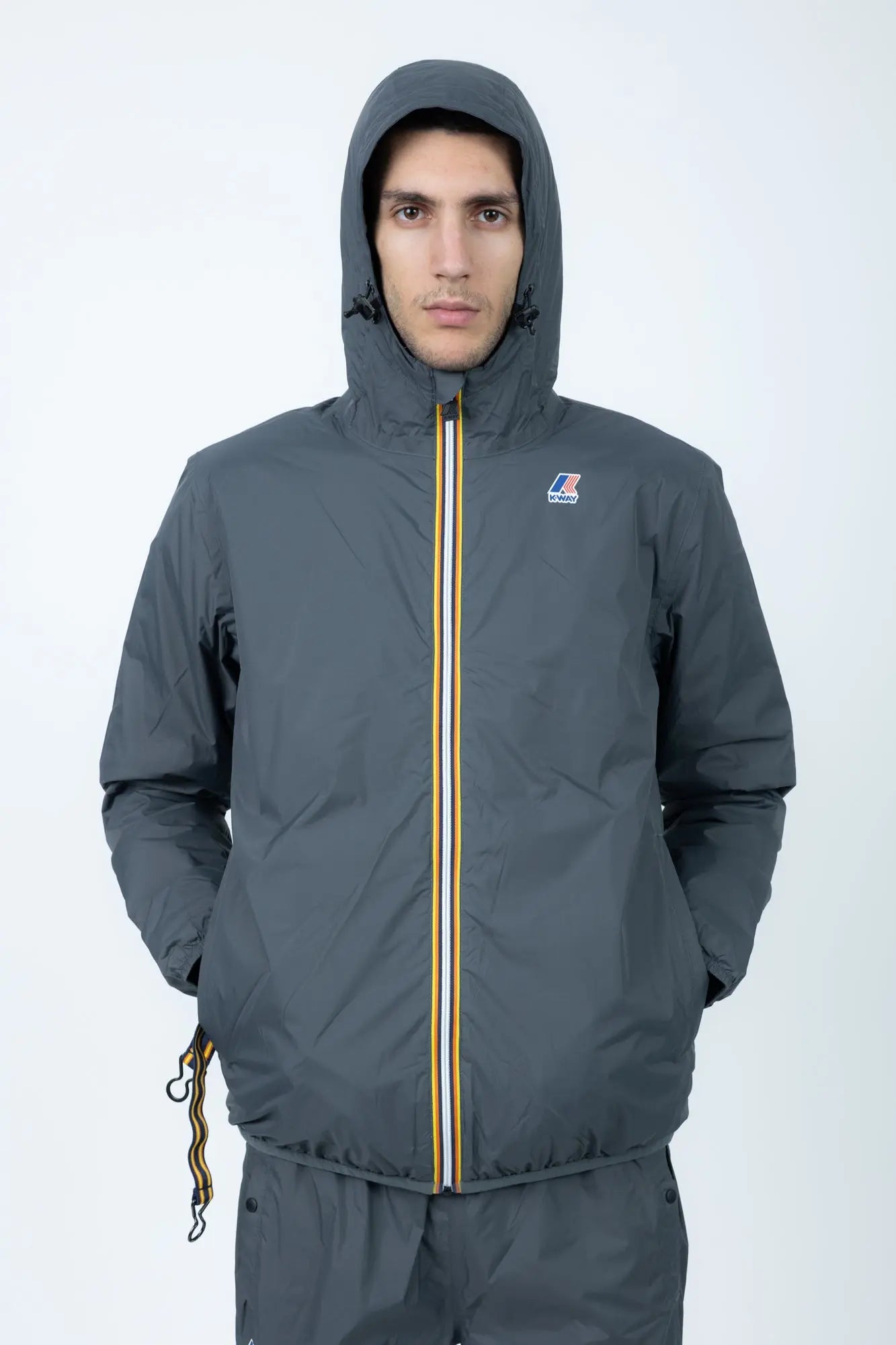 K-Way, Mens Jacket, Grey Shadow DK, Full-Zip, Hooded, Side Pockets, Branded Zippers, Packable, Unisex, Long Sleeves, Waterproof 10000 mm water column, Windproof, Breathable, Water-Repellent, Elasticated Cuffs and Hem, Breathability: 10000 g/sqm/24h, Front Portrait Hooded. 