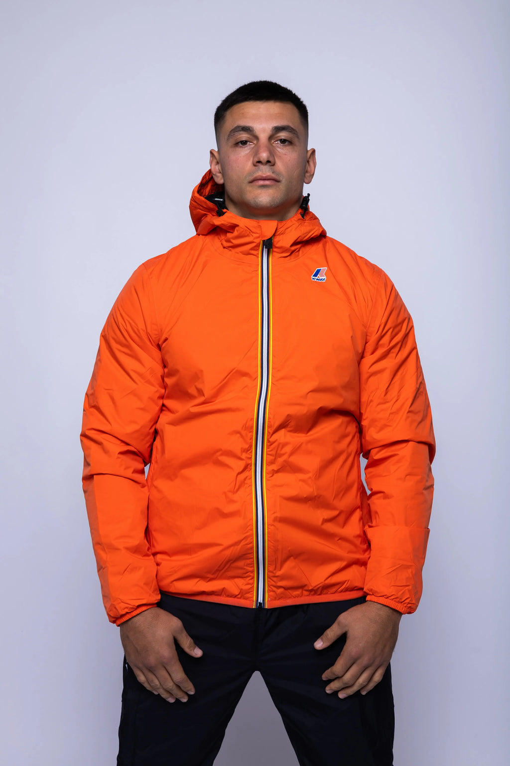K-Way, Mens Jacket, Orange Fiesta, Full-Zip, Hooded, Side Pockets, Branded Zippers, Packable, Unisex, Long Sleeves, Waterproof 10000 mm water column, Windproof, Breathable, Water-Repellent, Elasticated Cuffs and Hem, Breathability: 10000 g/sqm/24h, Front Portrait. 