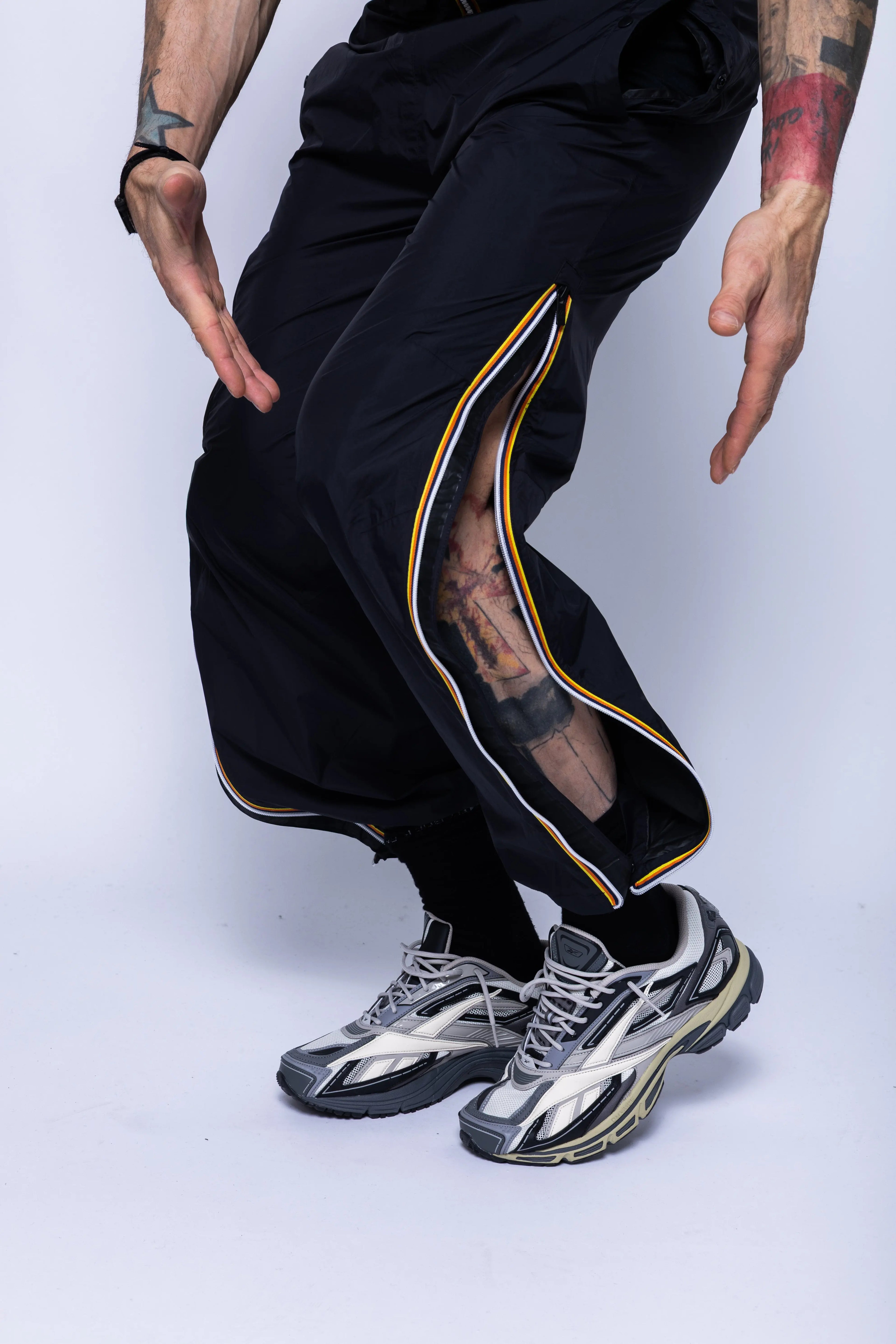 K-Way, Mens Pants, Black, Packable, Elasticated Waistband, Side Pockets, Back Pockets, Waterproof, Windproof, Breathable, Zip Pockets, Leg Zippers, Unzipped Close-up Front 3/4 View. 