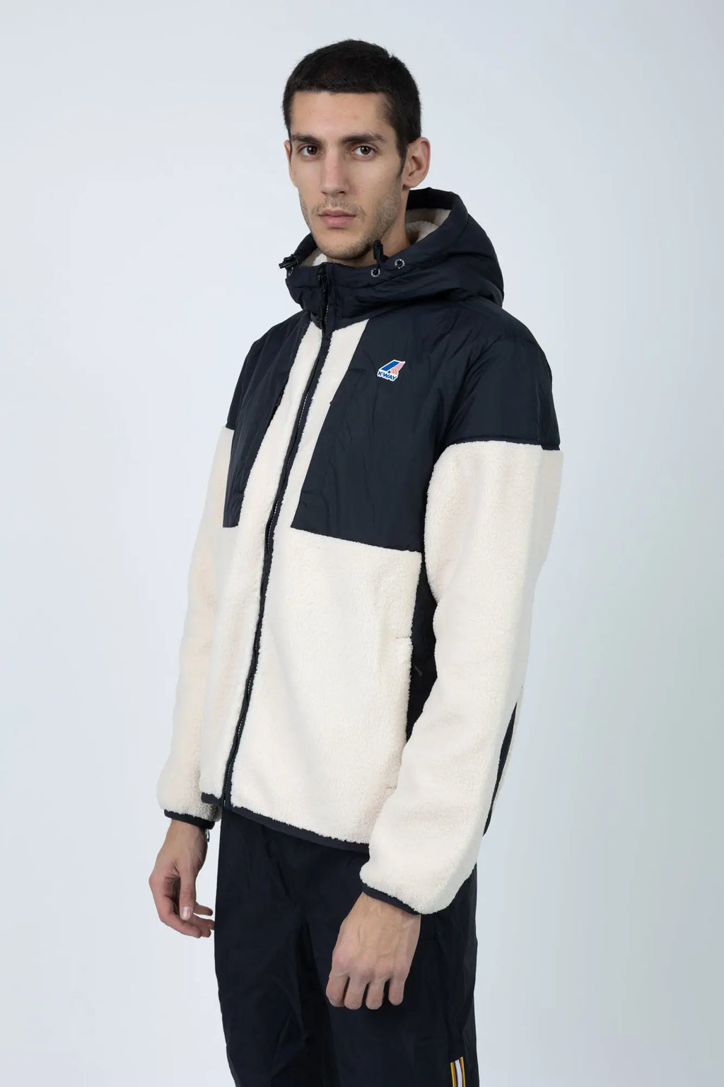 K-Way, Mens Hoodie, Black Pure-Ecru, Water Proof, Sherpa-Effect Fleece, Micro Ripstop Nylon, Hooded, Jacket, Sweatshirt, Full-Zip, SIde Pockets, Elasticated Cuffs and Hem, Front Pockets, Silicone Logo-Patch, Drawstring Hood, Zip Pockets, Side View. 
