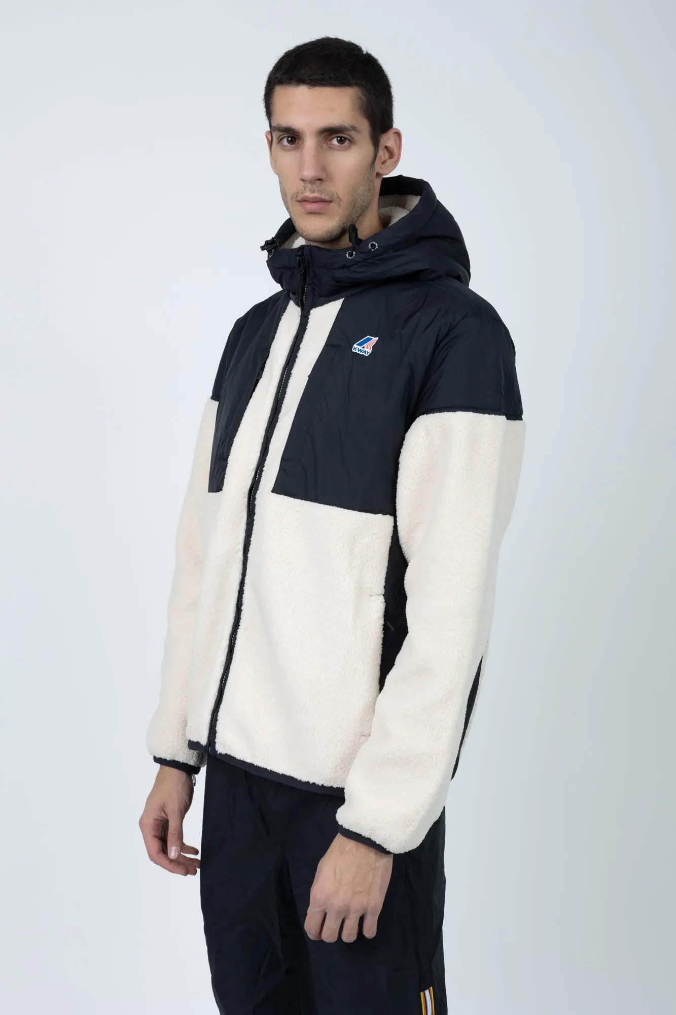 K-Way, Mens Hoodie, Black Pure-Ecru, Water Proof, Sherpa-Effect Fleece, Micro Ripstop Nylon, Hooded, Jacket, Sweatshirt, Full-Zip, SIde Pockets, Elasticated Cuffs and Hem, Front Pockets, Silicone Logo-Patch, Drawstring Hood, Zip Pockets, Side View. 