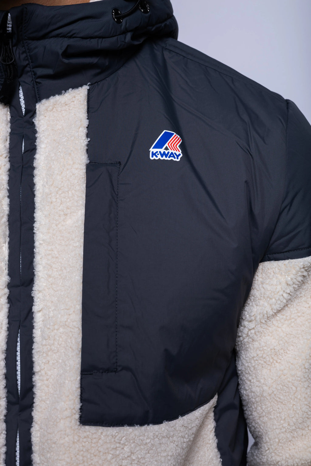 K-Way, Mens Hoodie, Grey Shadow DK-Ecru, Water Proof, Sherpa-Effect Fleece, Micro Ripstop Nylon, Hooded, Jacket, Sweatshirt, Full-Zip, SIde Pockets, Elasticated Cuffs and Hem, Front Pockets, Silicone Logo-Patch, Drawstring Hood, Zip Pockets, Chest Pocket and Logo Close-up. 