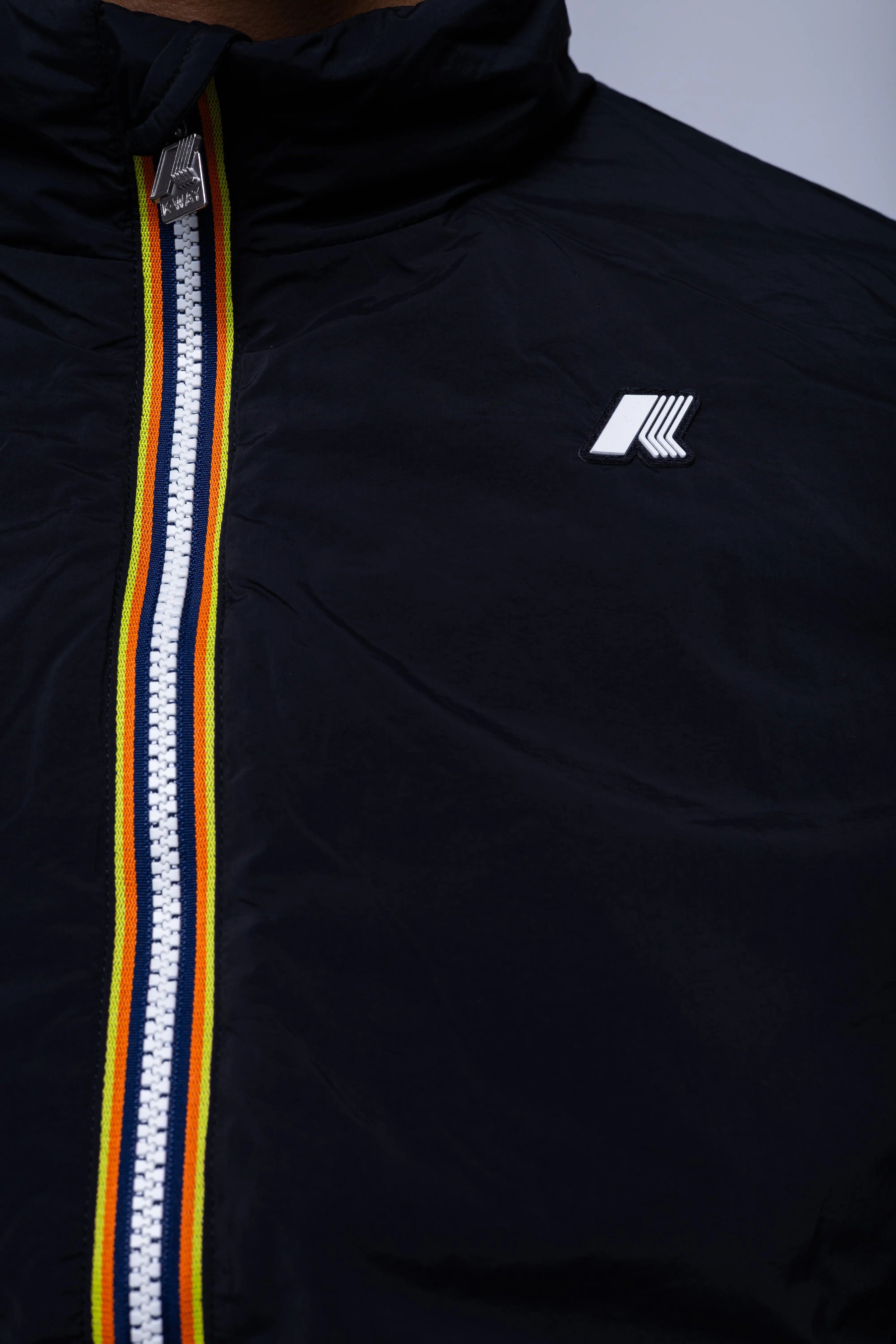 K-Way, Mens Vest Jacket, Black Pure, Sleeveless, Full Zip, Concealed Hood, Chest Logo, Branded Zippers, Side Pockets, Logo Close-up. 