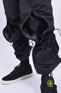 Nilmance, Mens Pants, Black, Ventilation Mesh Inserts, Side Pockets, Double Back Pockets, Elasticated Legs, Elasticated Ankles, Drawcord Waistband, Belt Loops, Elasticated Knee Modules, Snap Fastening Knee Panels, Fully Customizable, Knee Elastics Showcase Close-up. 