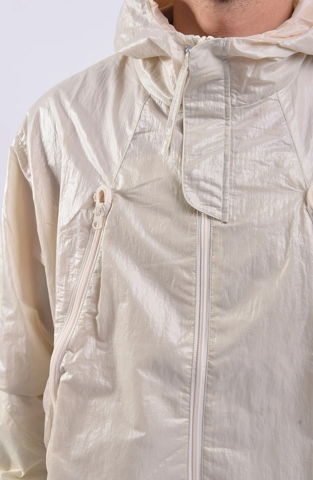 Nilmance, Mens Jacket, Ivory, Full-Zip, Hooded, YKK Zippers, Side Pockets, Waterproof, Windproof, Water-Repellent, Elasticated Cuffs, Zip Pockets, Velcro, Snap Buttons, Pockets Close-up. 