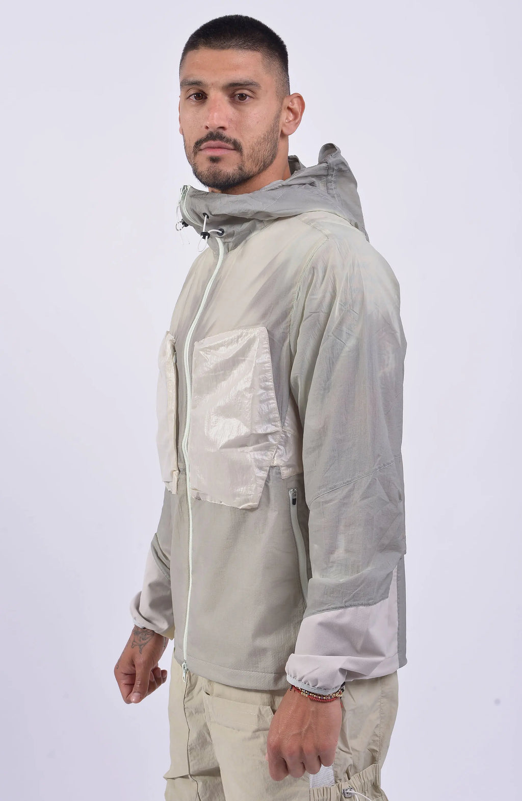 Nilmance, Mens Jacket, Ivory, Thermo Sensitive, Water-Repellent, Centre Zip Closure, Full-Zip, Bellows Zip Pockets, Elasticated Cuffs, Elastic Drawcord Hood, Zipper Ending at hood, YKK Zippers, Front Portrait 3/4 View. 