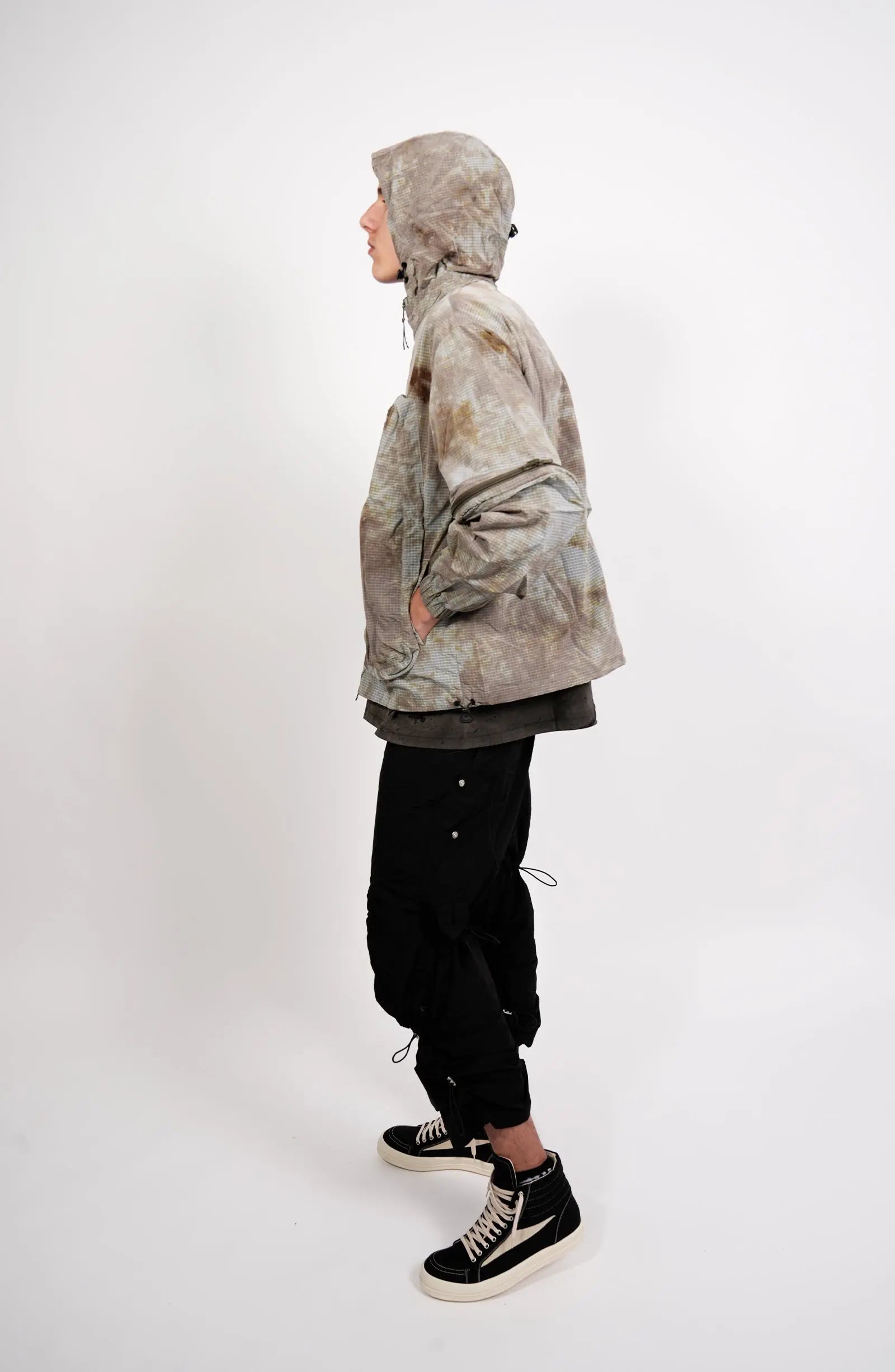 Nilmance, Mens Jacket, Garment Dyed, Grey, Brown, Acid, Cargo Pockets, Side Pockets, Hooded, Drawcord, Elastic Cuffs, Full Zip, Zip Pockets, YKK Zippers, Large Bellows Pockets, Full Body Side View. 