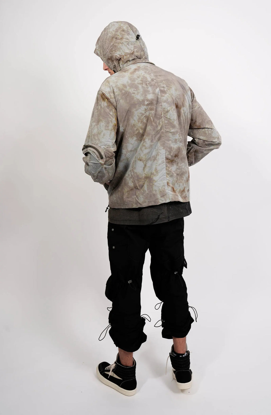Nilmance, Mens Jacket, Garment Dyed, Grey, Brown, Acid, Cargo Pockets, Side Pockets, Hooded, Drawcord, Elastic Cuffs, Full Zip, Zip Pockets, YKK Zippers, Large Bellows Pockets, Back 3/4 View. 