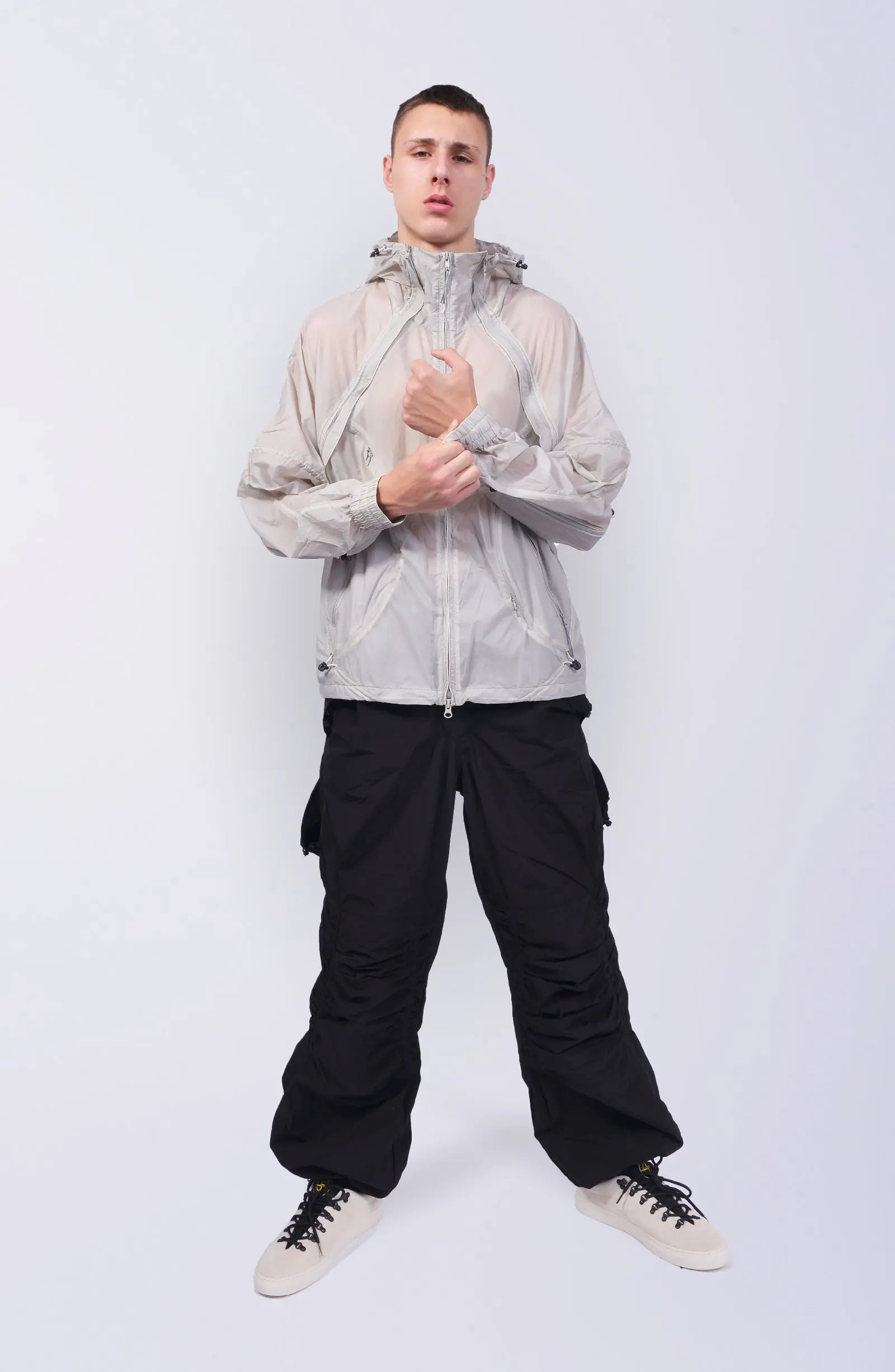 Nilmance, Mens Jacket, Transparent, Light Grey, Gray, Full Zip, Zip Ventilation Openings, Elasticated Cuffs, Cinch Hood, Drawcord Hood, Side Zip Pockets, Lightweight, Windproof, Full Body Front View. 
