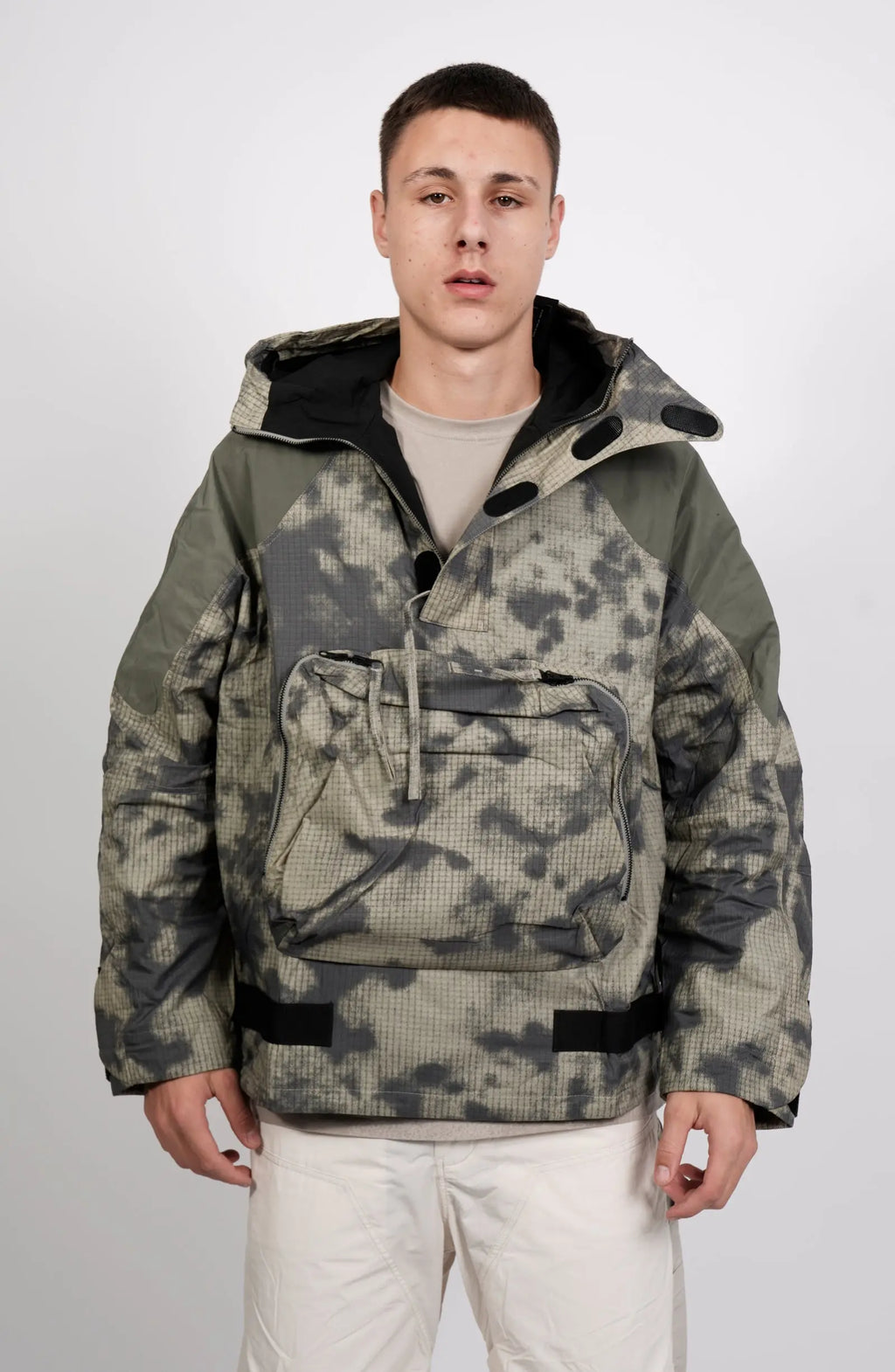 Nilmance, Mens Jacket, Green Camo, Elastic Concealed Drawcord Hood and Hem, Velcro Adjustable Cuffs and Hood, Large Front Zip Pocket, YKK Zippers, Ripstop Nylon, Water-repellent treated, Front Open View. 