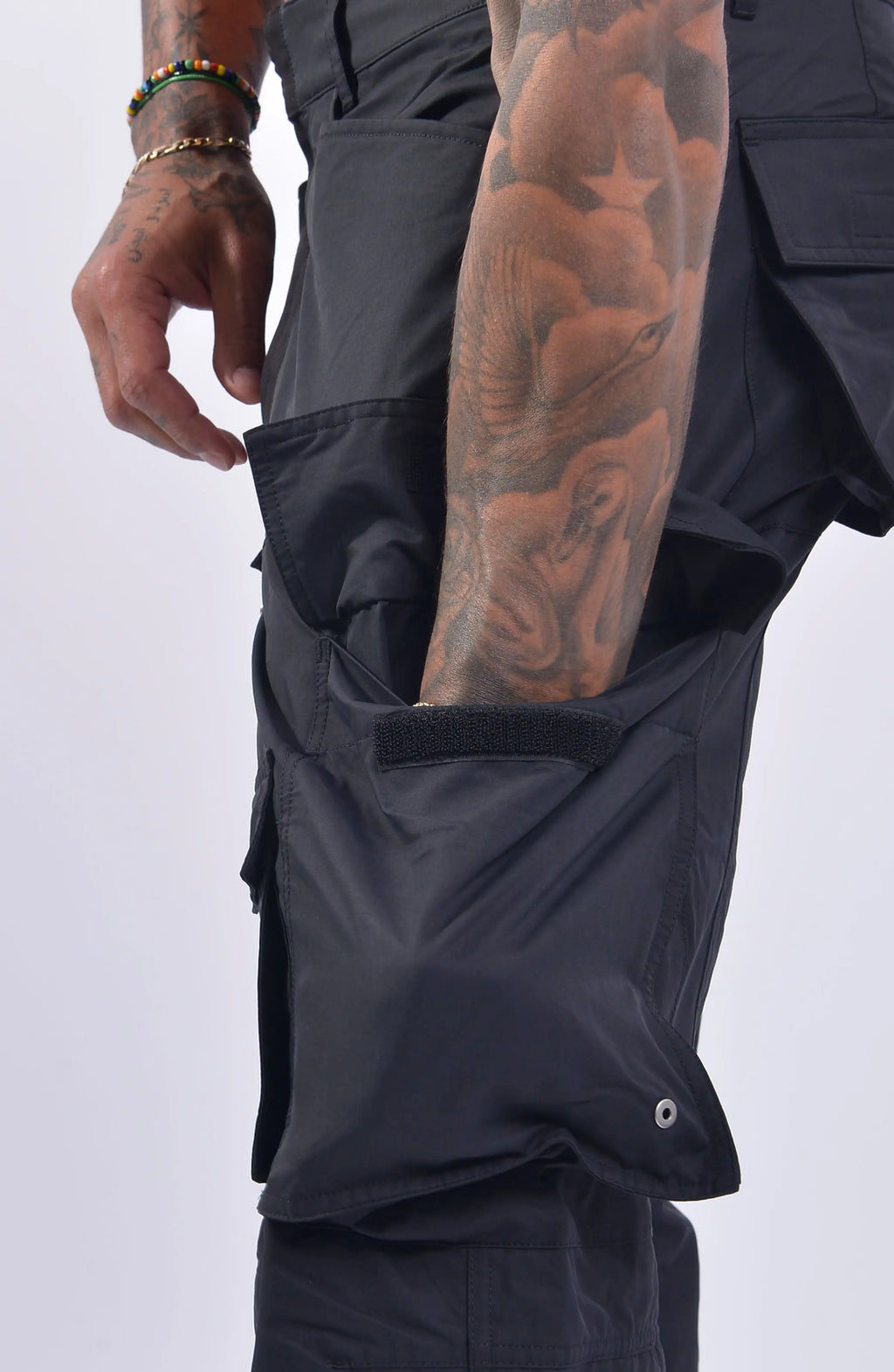 Nilmance, Mens Trousers, Black, Cargo Pockets, Water Repellent, Nylon Cotton Blend, Zipper Details, Wide Fit, Straight Leg, Side and Front Pockets, Belt Loops, Zip Fly, YKK Zippers, Ventilation Opening, Snap Fastening, Side Pocket Showcase. 