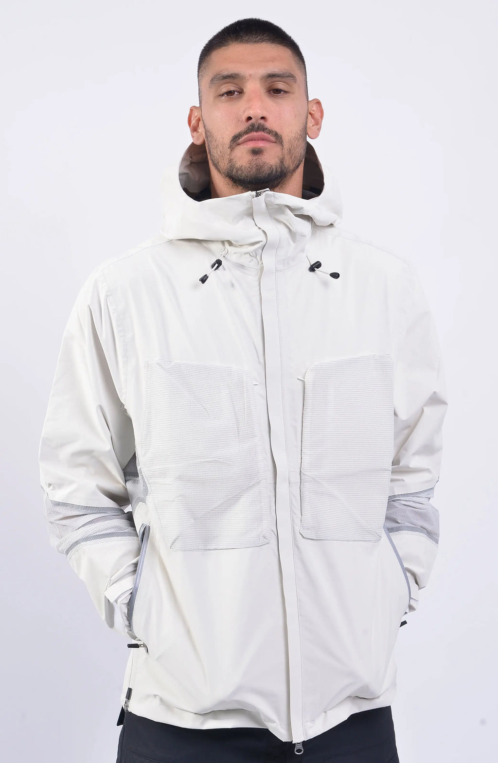Nilmance, Mens Jacket, White, Hooded, Elasticateed Drawcord, Full Zip, Ripstop Bellows Pockets, YKK Zippers, YKK METALUXE®, YKK AQUAGUARD®, Vislon, Elasticated Cuffs, Waterproof, Windproof, Taped Seams, Laminated Fabric, Zip Pockets, Front Portrait Hands in Pockets. 