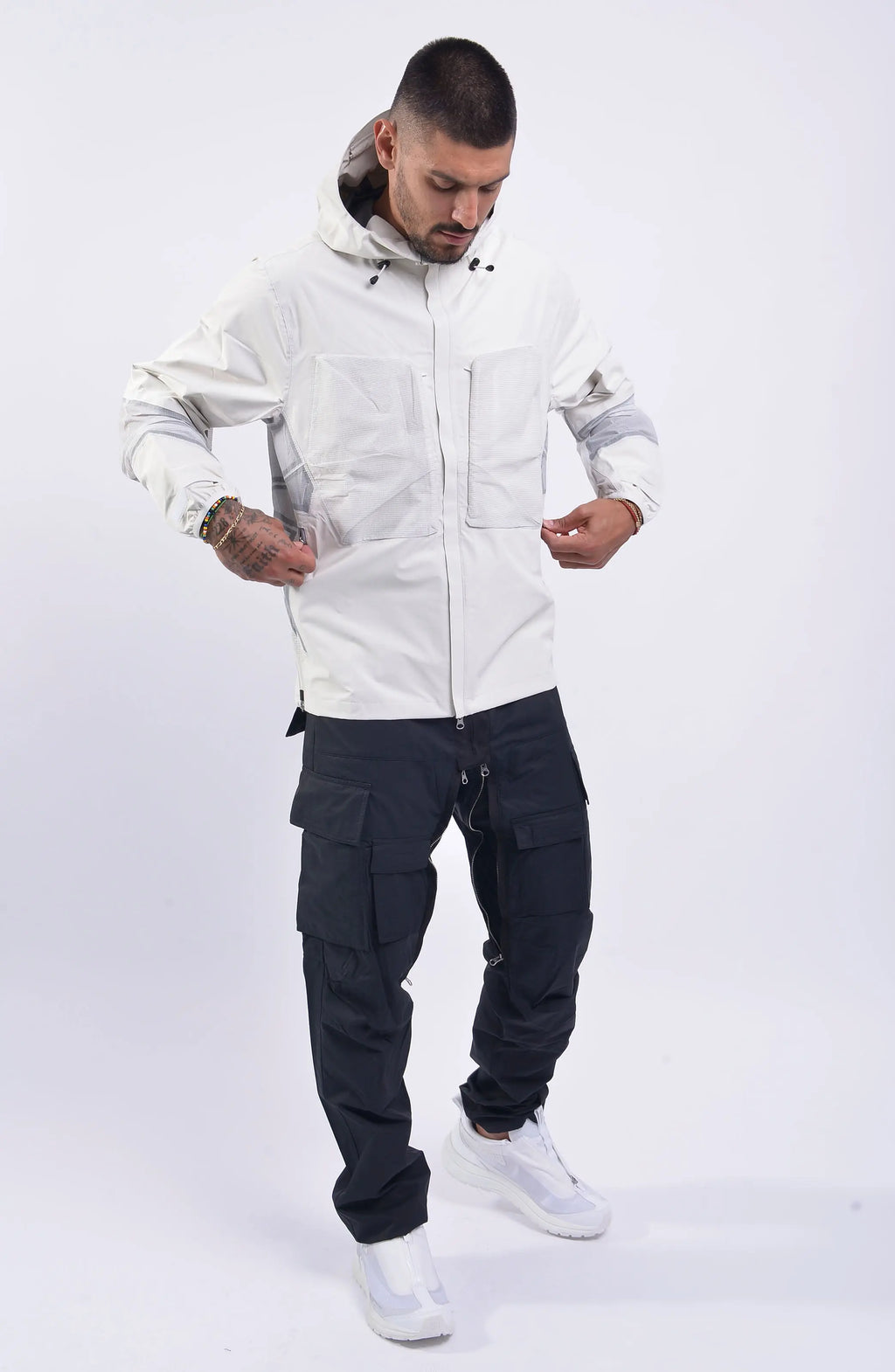 Nilmance, Mens Jacket, White, Hooded, Elasticateed Drawcord, Full Zip, Ripstop Bellows Pockets, YKK Zippers, YKK METALUXE®, YKK AQUAGUARD®, Vislon, Elasticated Cuffs, Waterproof, Windproof, Taped Seams, Laminated Fabric, Zip Pockets, Full Body Unzipping Chest Pockets Front View. 