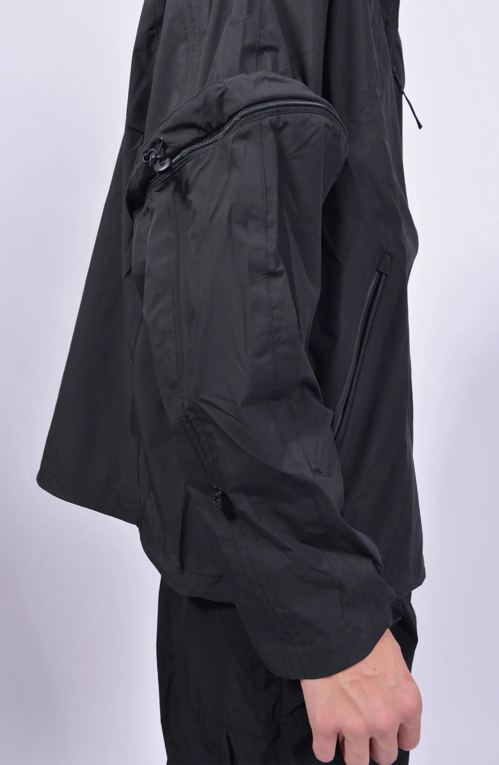 Nilmance, Mens Jacket, Black, Waterproof 10k, Windproof, Water-Repellent, Full-Zip, Zip Pockets, Side Pockets, Hidden Pockets, Detachable Sleeves, Velcro Adjustable Cuffs, Drawcord Hood, Cinch Hood, Zip Ventilation Openings, Detachable Sleeve Zipped Up. 