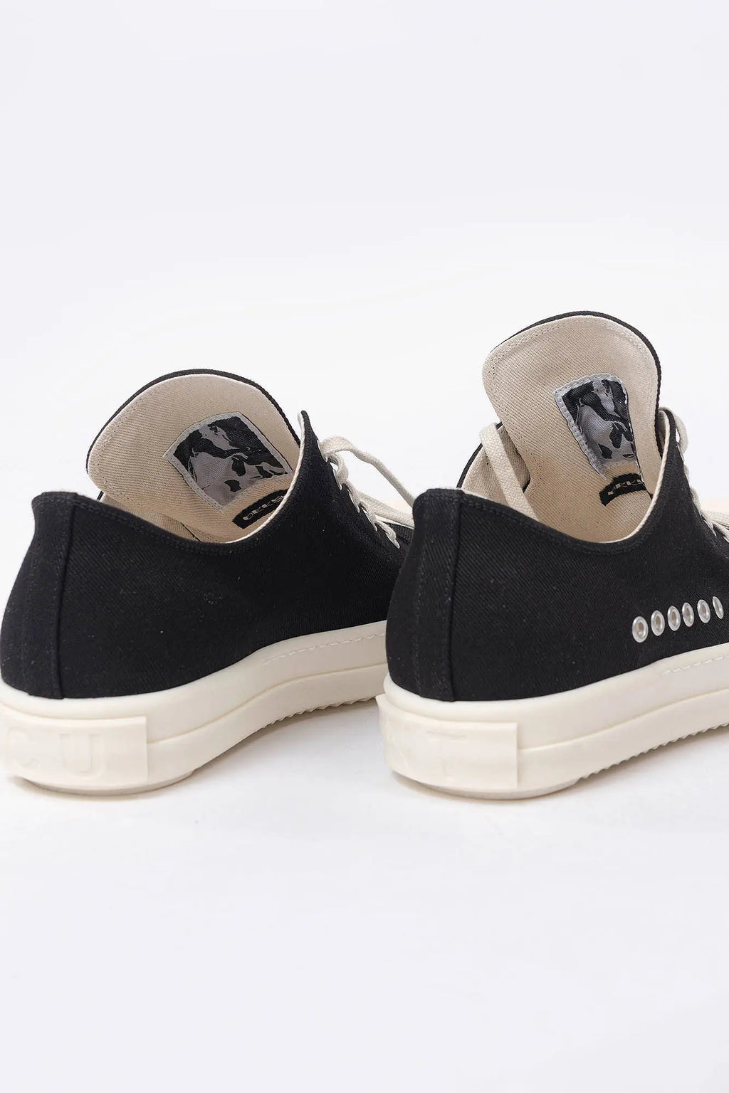 Rick Owens DRKSHDW, Mens Sneakers, Black Milk, Denim Sneakers with Rubber Soles, Signature Cunt Lettering at Heels, Lace-up low top, White Rubber, DRKSHDW Lettering on insoles, Breathability Holes, Back 3/4 View. 