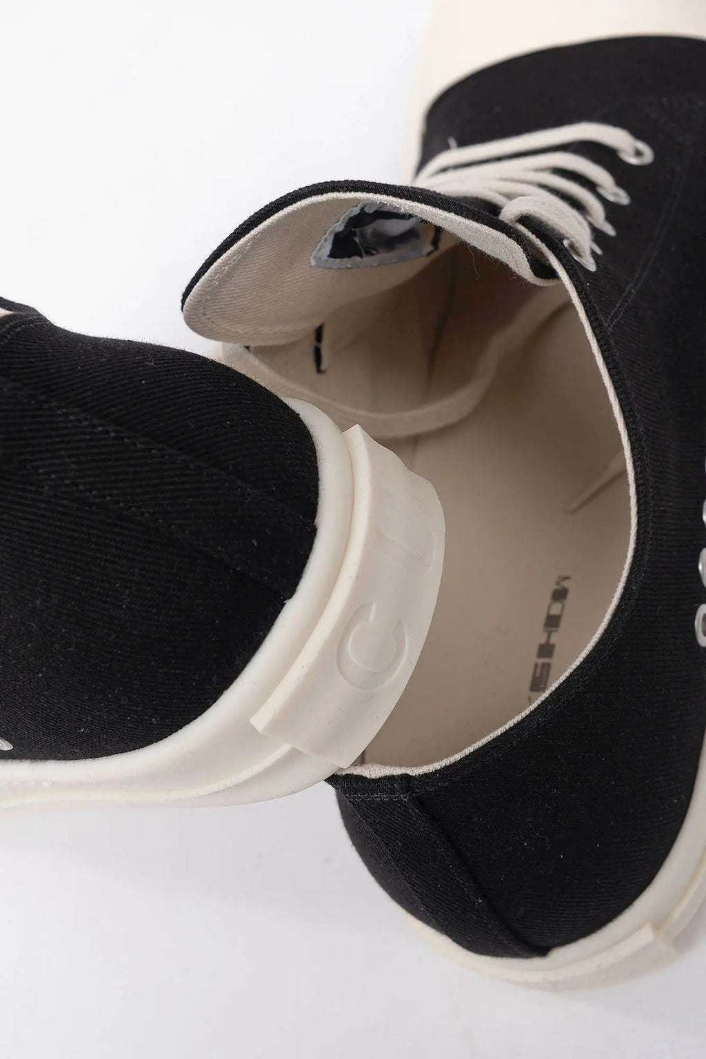 Rick Owens DRKSHDW, Mens Sneakers, Black Milk, Denim Sneakers with Rubber Soles, Signature Cunt Lettering at Heels, Lace-up low top, White Rubber, DRKSHDW Lettering on insoles, Breathability Holes, One on top Of the Other Close-up View. 