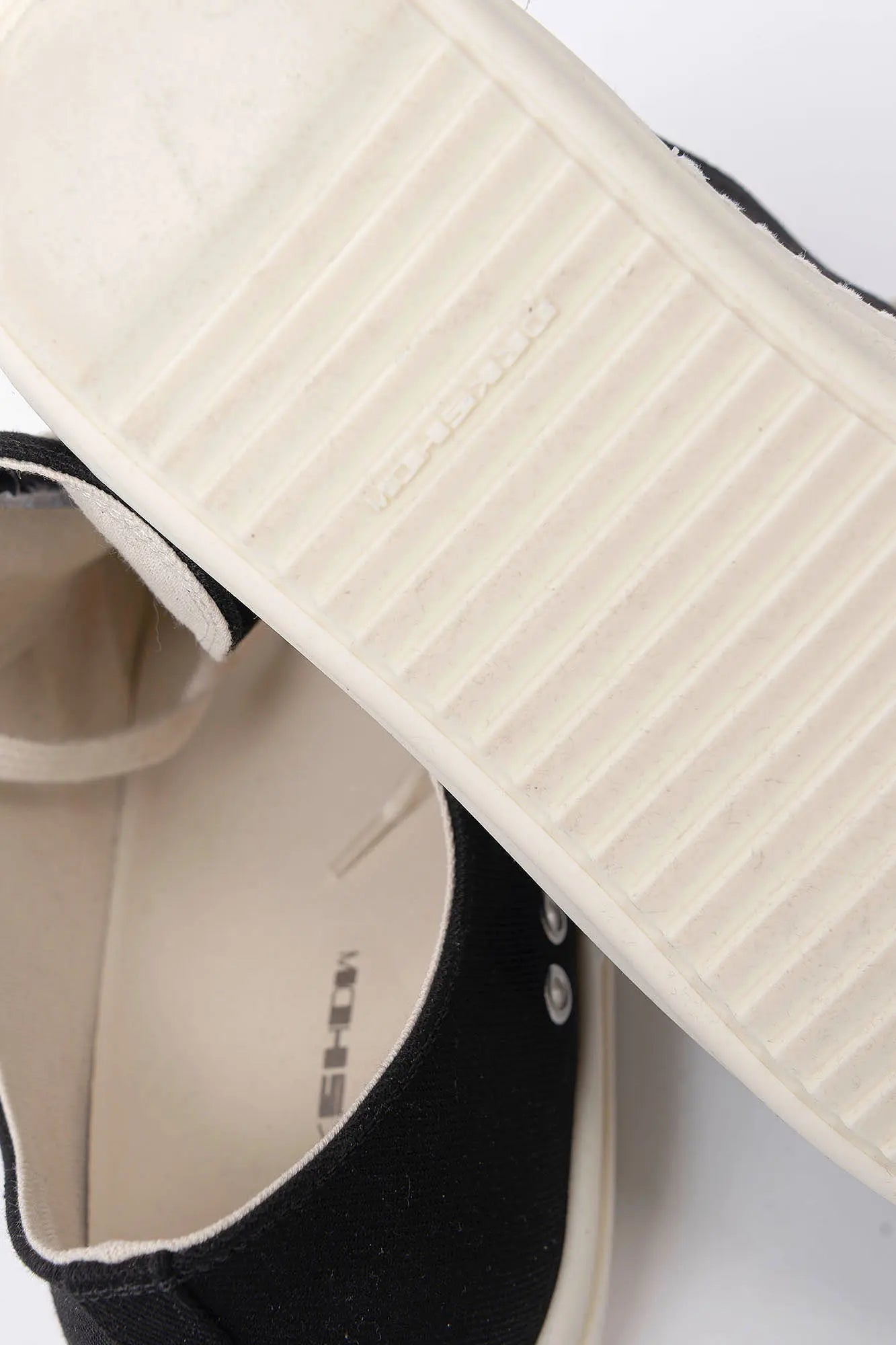 Rick Owens DRKSHDW, Mens Sneakers, Black Milk, Denim Sneakers with Rubber Soles, Signature Cunt Lettering at Heels, Lace-up low top, White Rubber, DRKSHDW Lettering on insoles, Breathability Holes, Underside Close-up View. 