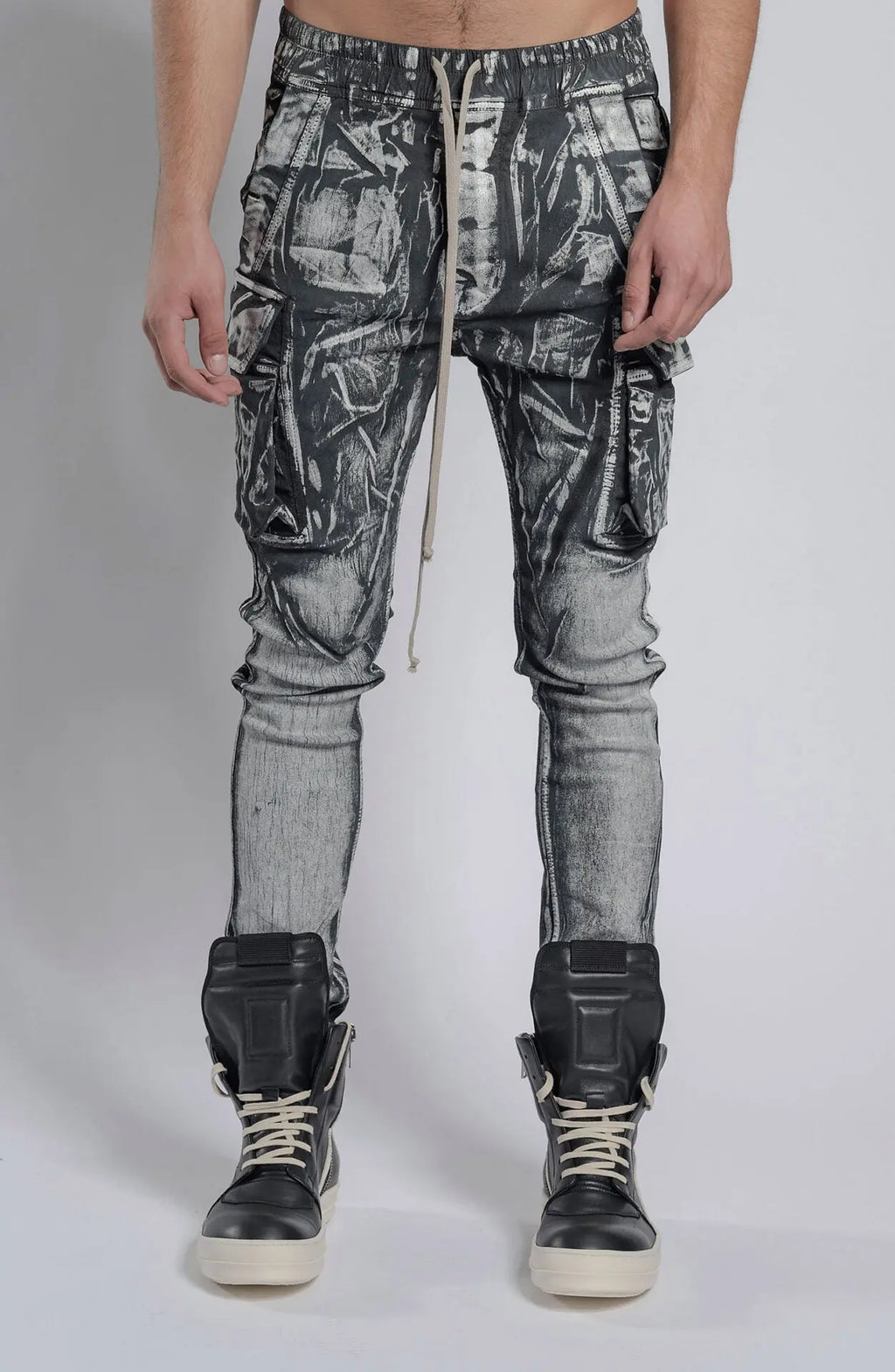 Rick Owens,Mens Denim Pants,Elastic Waistband,Drawstrings,Elastic Cuffs,Two Zippered Cargo Pockets On The Outer Thigh With Flaps,Two Back Patch Pockets With Flaps,Front Portrait.