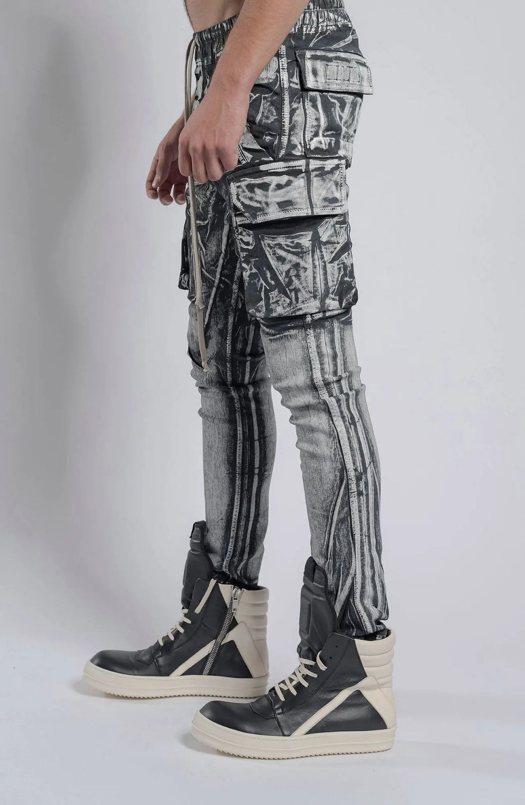 Rick Owens,Mens Denim Pants,Elastic Waistband,Drawstrings,Elastic Cuffs,Two Zippered Cargo Pockets On The Outer Thigh With Flaps,Two Back Patch Pockets With Flaps,Profile View.