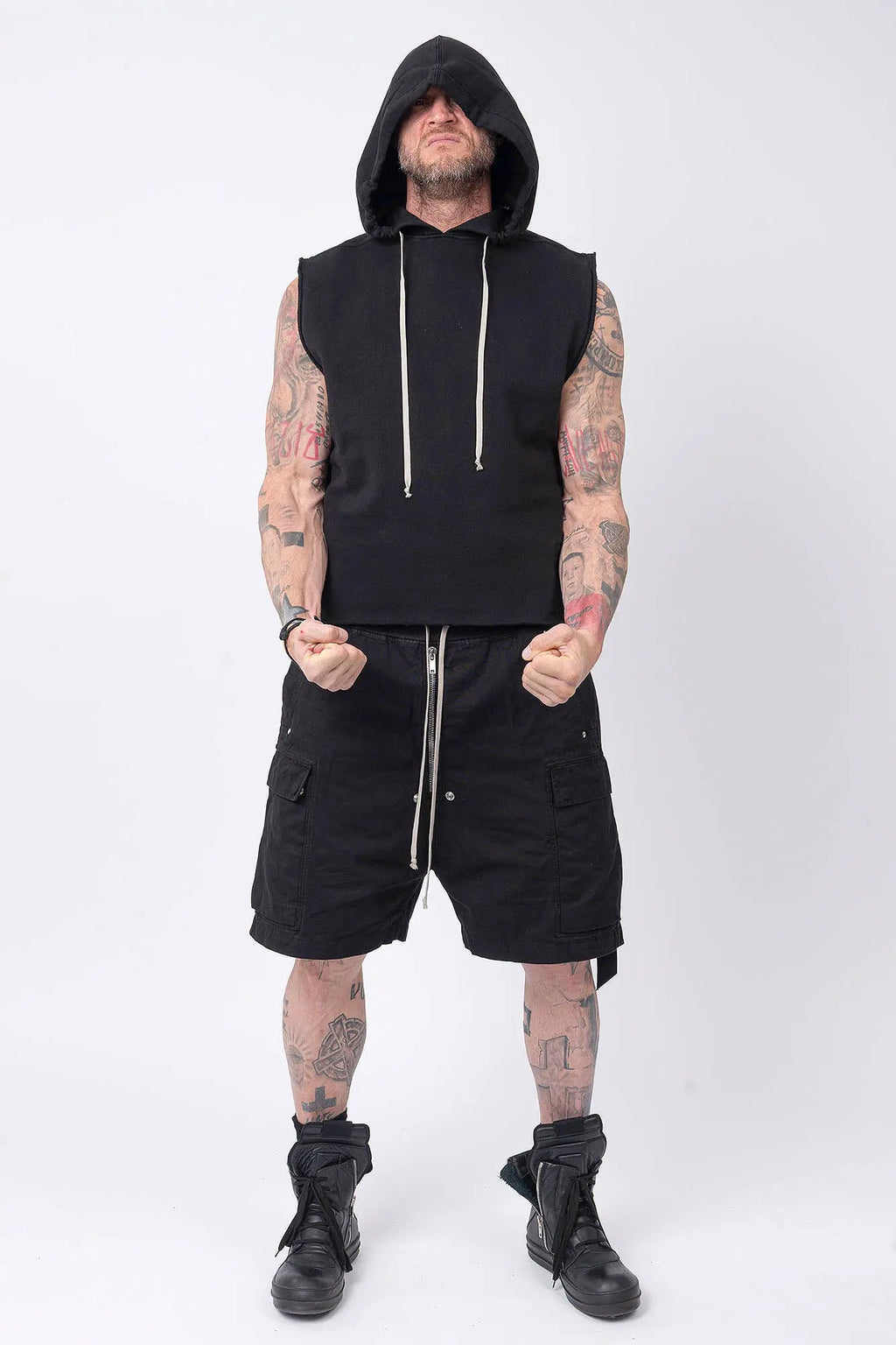 Rick Owens,Mens Shorts,Knee Lenght,Low Crotch,Wide Leg,Elastic Waistband With Drawstrings,Bela Exposed Center Zipper With Two Snap Detail,Two Side Beveled Cargo Pockets With Concealed Snaps And Topstitching , Two Rear Welt Pockets With Concealed Snaps And Topstitching, Lightweight Wash Milk Denim,Black And Natural 8OZ Denim,Dyed,Waxed By Hand,Front View.