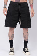 Rick Owens,Mens Shorts,Knee Lenght,Low Crotch,Wide Leg,Elastic Waistband With Drawstrings,Bela Exposed Center Zipper With Two Snap Detail,Two Side Beveled Cargo Pockets With Concealed Snaps And Topstitching , Two Rear Welt Pockets With Concealed Snaps And Topstitching, Lightweight Wash Milk Denim,Black And Natural 8OZ Denim,Dyed,Waxed By Hand,Front Portrait.