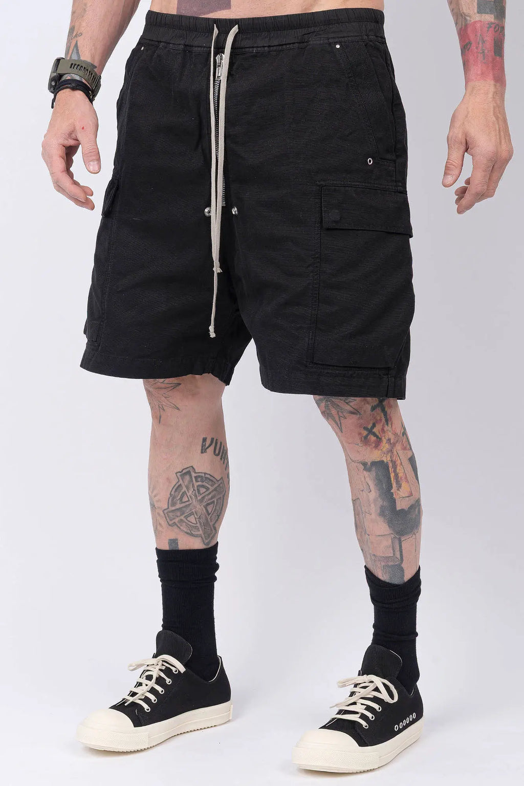 Rick Owens,Mens Shorts,Knee Lenght,Low Crotch,Wide Leg,Elastic Waistband With Drawstrings,Bela Exposed Center Zipper With Two Snap Detail,Two Side Beveled Cargo Pockets With Concealed Snaps And Topstitching , Two Rear Welt Pockets With Concealed Snaps And Topstitching, Lightweight Wash Milk Denim,Black And Natural 8OZ Denim,Dyed,Waxed By Hand,Front Portrait.