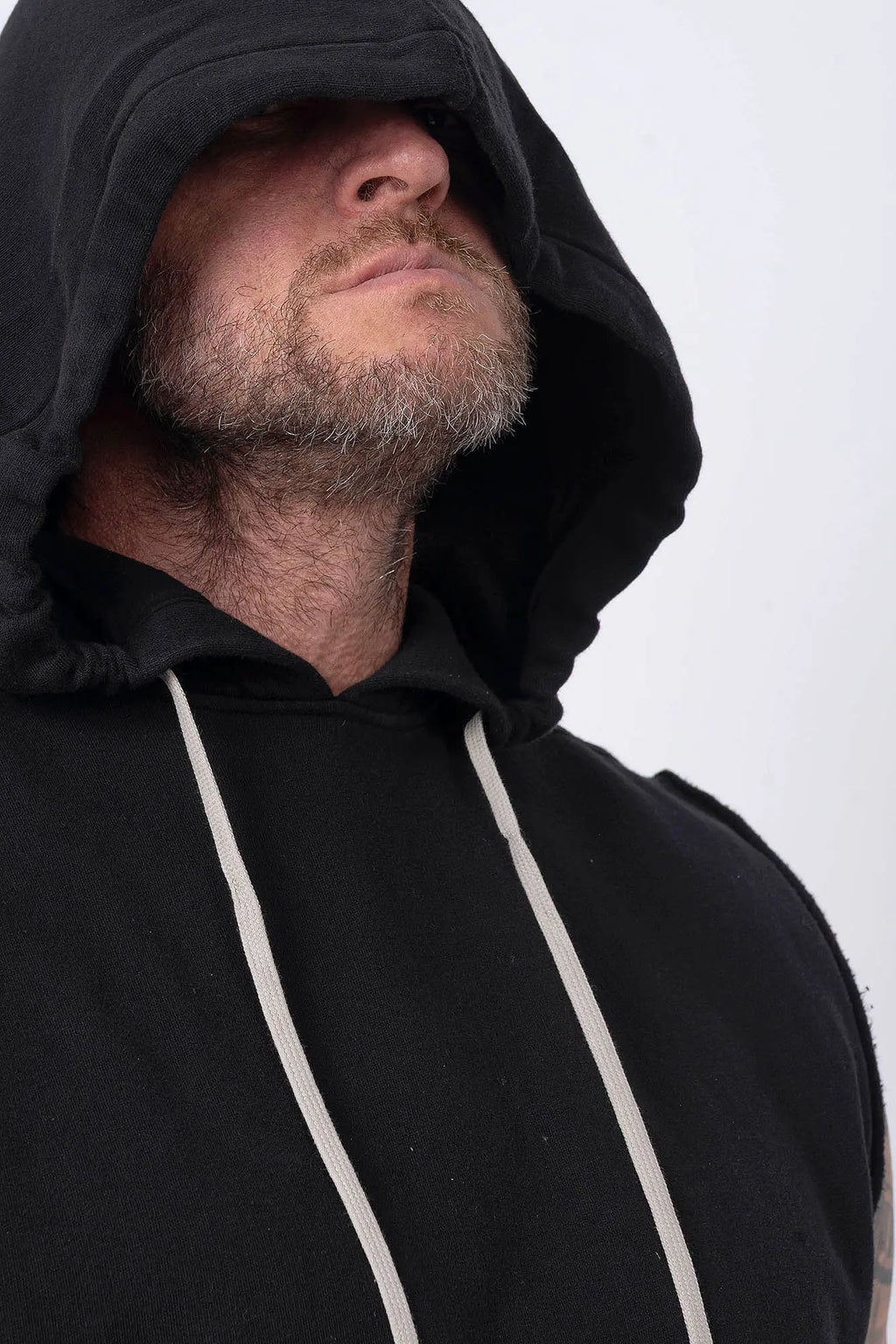 Rick Owens, Mens Temple Tunic,Hip Length,Sleeveless,Black Furka Heavy Sweatshirt Jersey,Large Hood With Drawstrings,Wide Square Body,Garment Dyed,GOTS Certified Organic Cotton,Front View.
