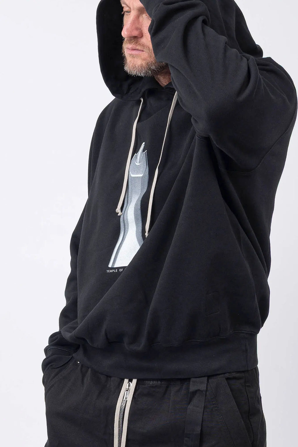 Rick Owens,Mens Hoodie,GOTS-Certified Organic Cotton Fleece Hoodie,Garment Dyed In Black,Hood With Drawstrings,Rib-Knit Hem And Cuffs,Central Ceam At Back,Temple of Love OWENSCORP Print,Saddle Shoulders,Side View.